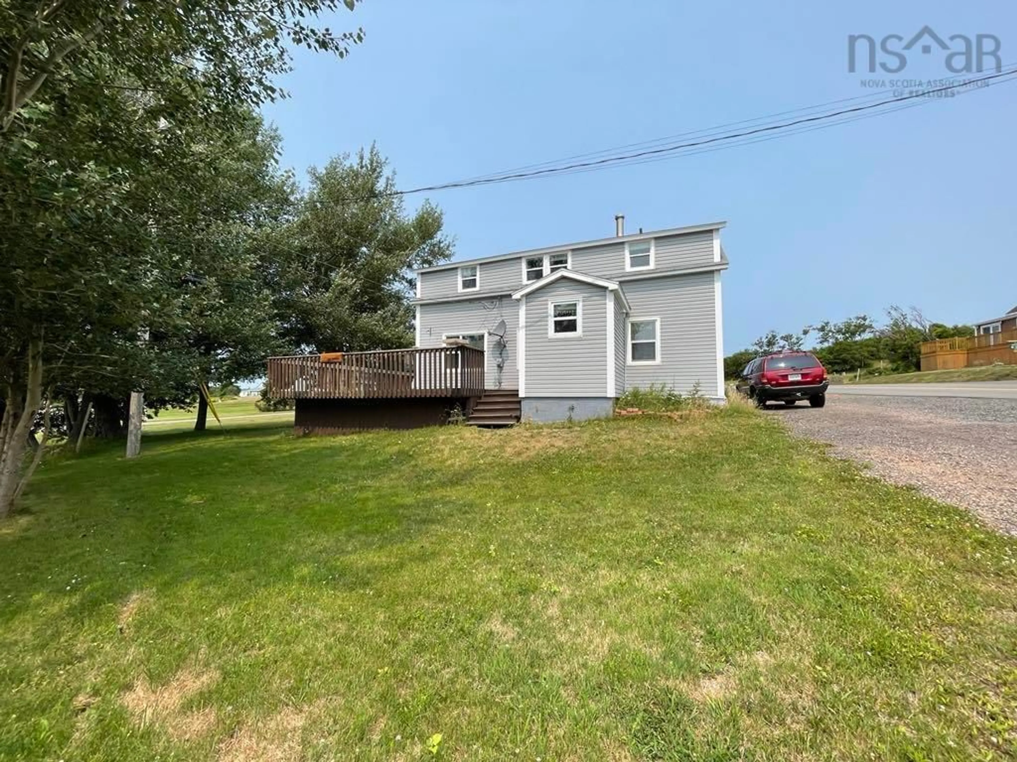A pic from outside/outdoor area/front of a property/back of a property/a pic from drone, street for 27 Cheticamp Back Rd, Point Cross Nova Scotia B0E 1H0