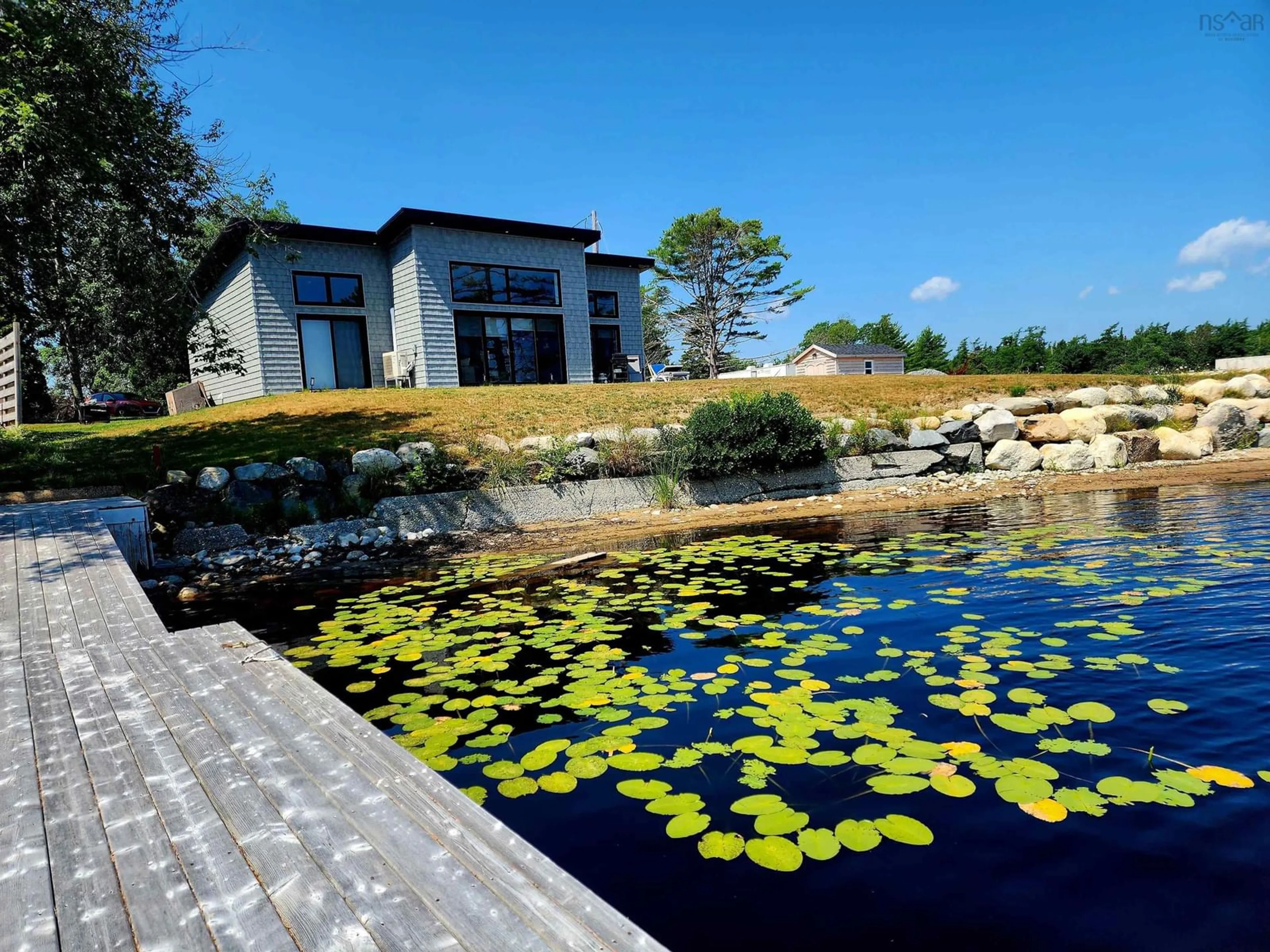 A pic from outside/outdoor area/front of a property/back of a property/a pic from drone, water/lake/river/ocean view for 87 Old Orchard Lane Beaverdam Lake ##5, Beaver Dam Nova Scotia B0T 1W0