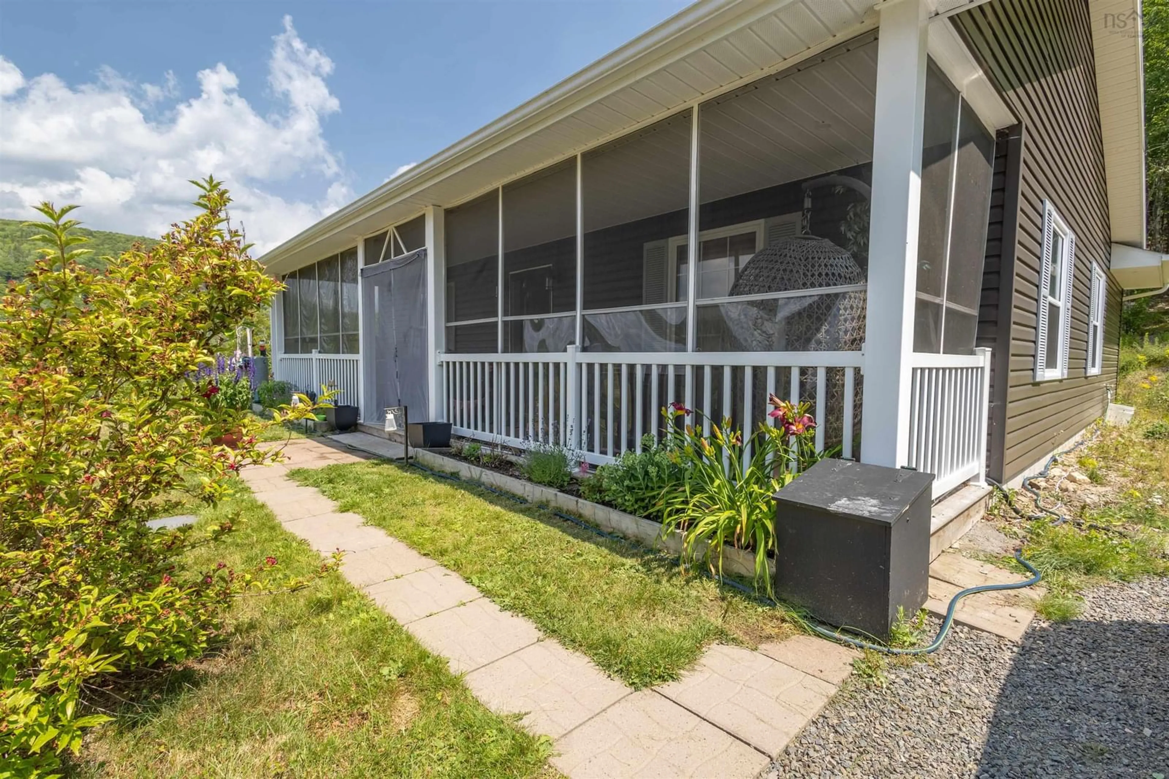 Home with vinyl exterior material, street for 47519 Cabot Trail, Tarbot Nova Scotia B0E 1B0