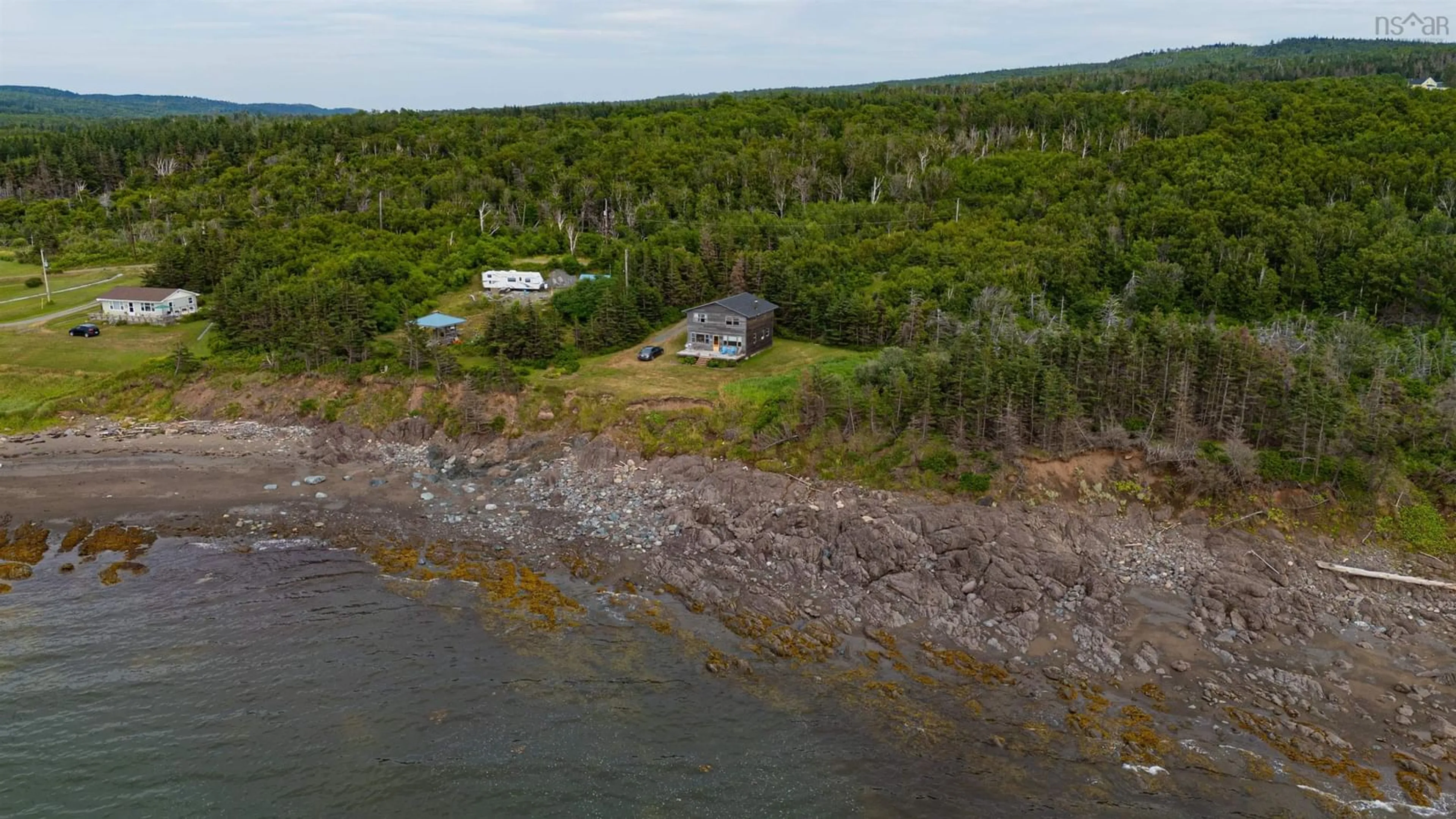 A pic from outside/outdoor area/front of a property/back of a property/a pic from drone, water/lake/river/ocean view for 83 Cottage Country Rd, Livingstone Cove Nova Scotia B2G 2L1