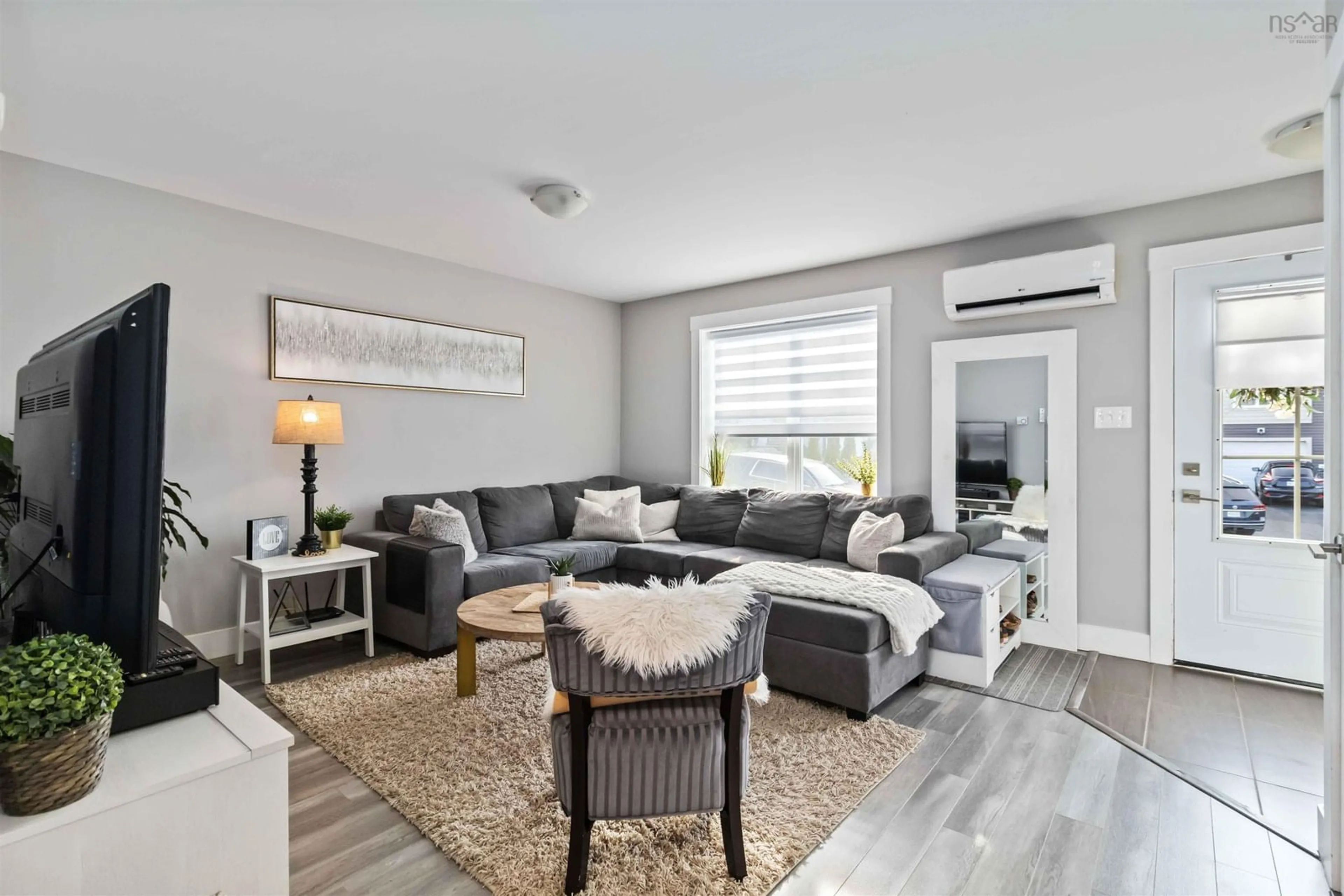 Living room with furniture, wood/laminate floor for 54 Fescue Crt, Middle Sackville Nova Scotia B4E 0L8