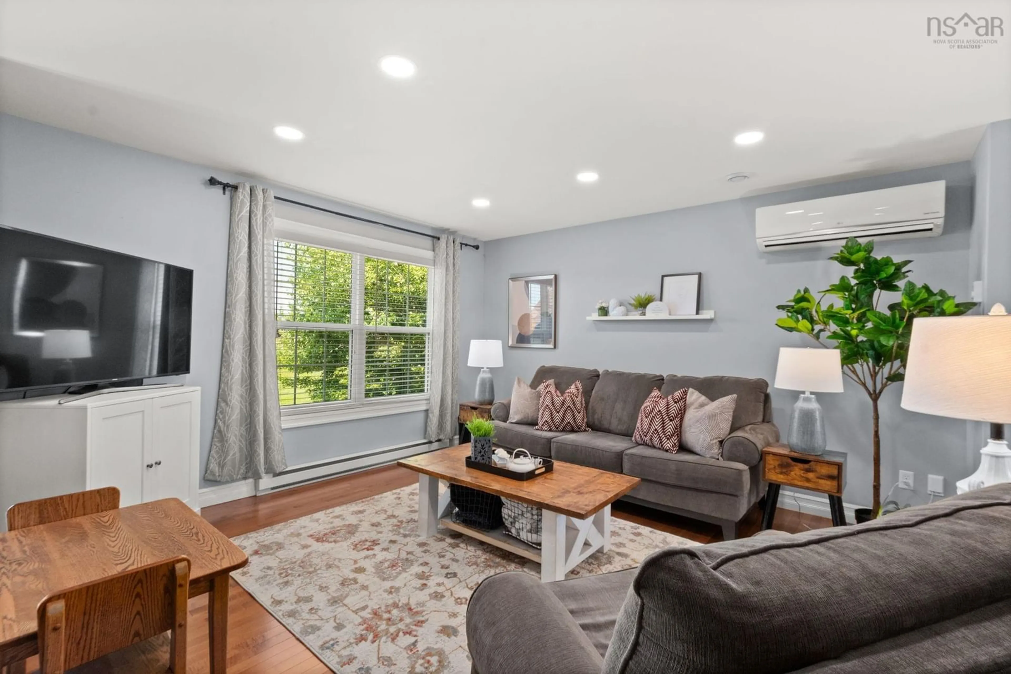 Living room with furniture, wood/laminate floor for 285 Gammon Lake Dr, Lawrencetown Nova Scotia B2Z 1T9