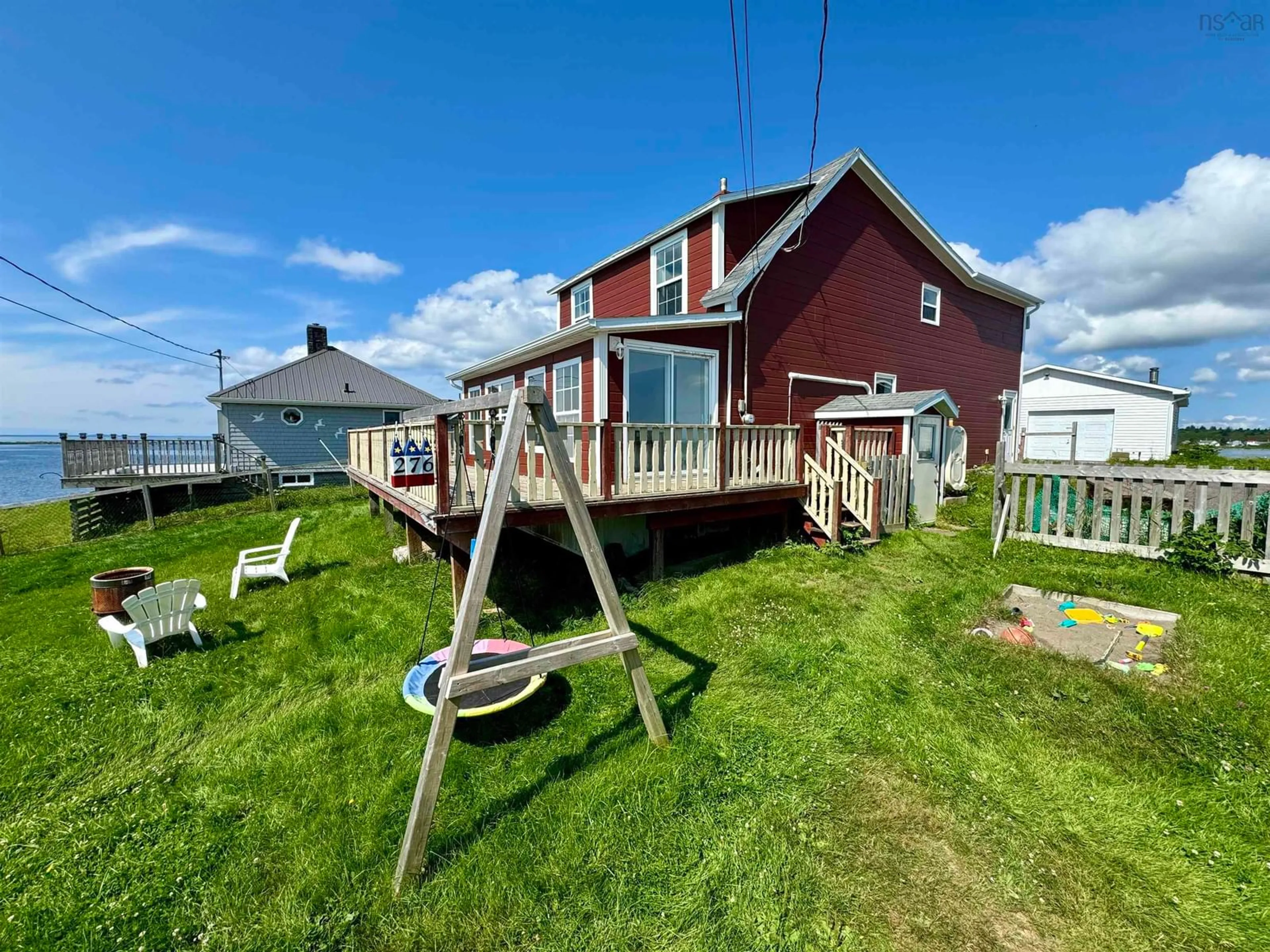 A pic from outside/outdoor area/front of a property/back of a property/a pic from drone, water/lake/river/ocean view for 276 Southside Petit De Grat Rd, Alderney Point Nova Scotia B0E 2L0