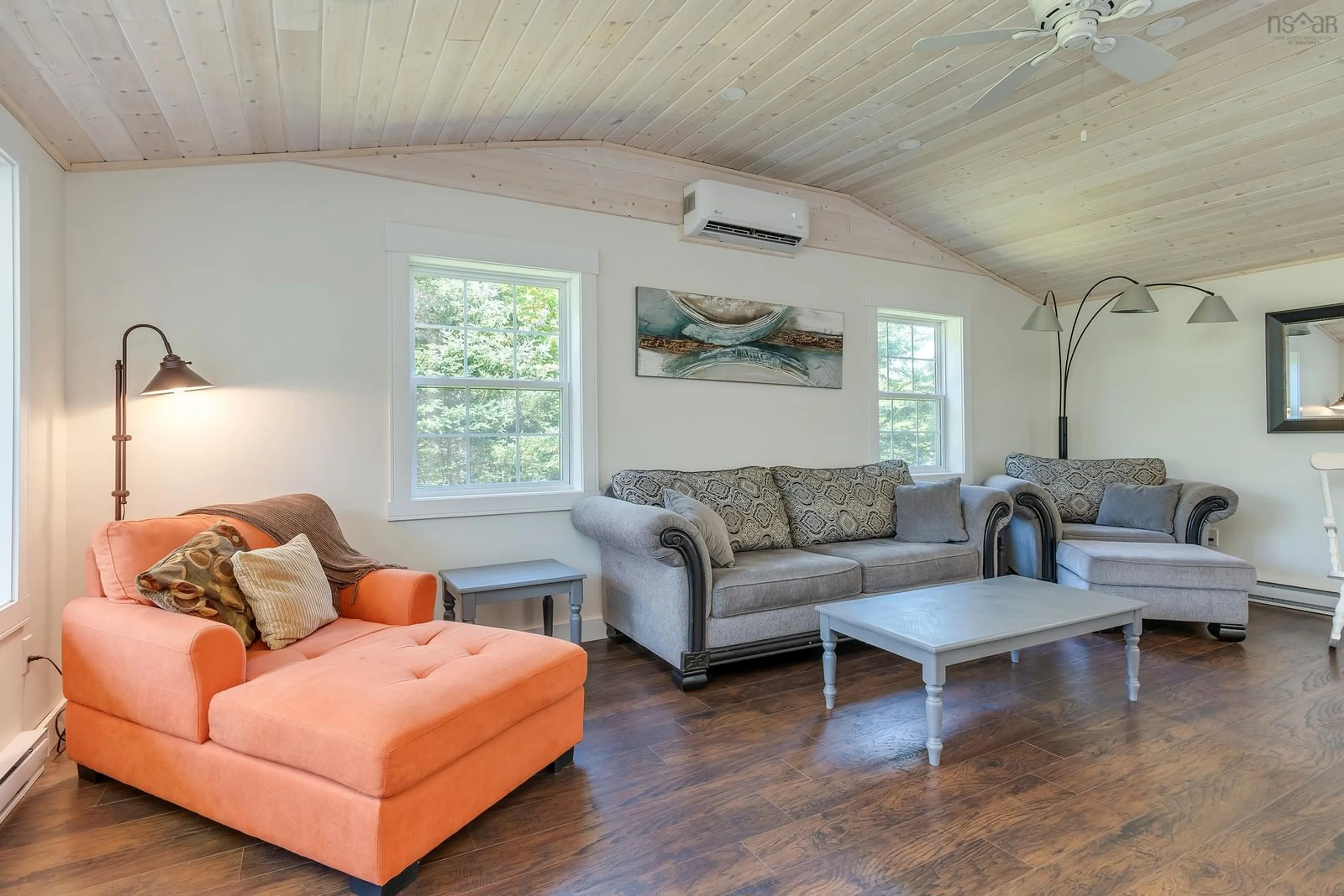 Living room with furniture, wood/laminate floor for 20 Howard Stevens Walk, Clam Harbour Nova Scotia B0J 2L0