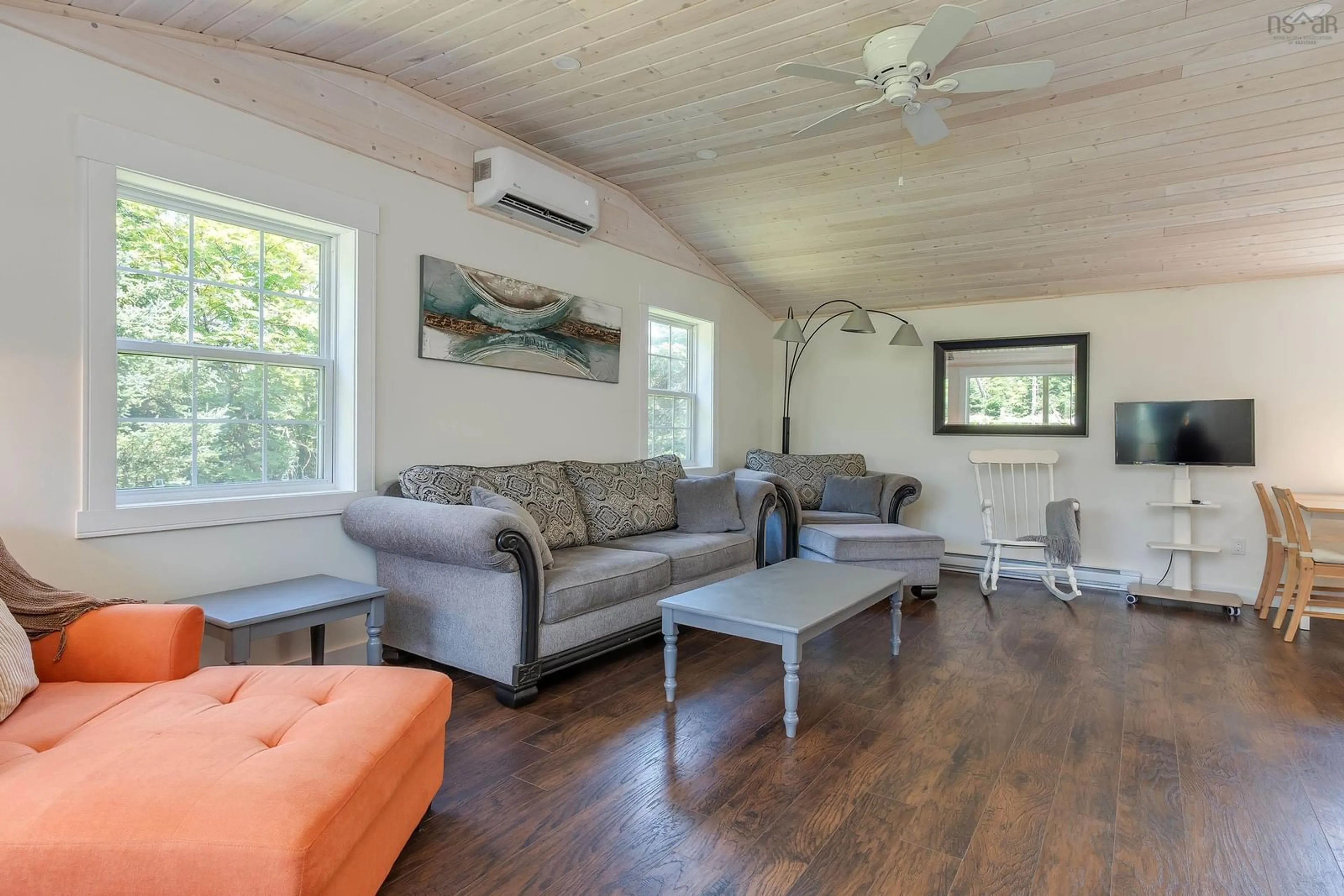 Living room with furniture, wood/laminate floor for 20 Howard Stevens Walk, Clam Harbour Nova Scotia B0J 2L0