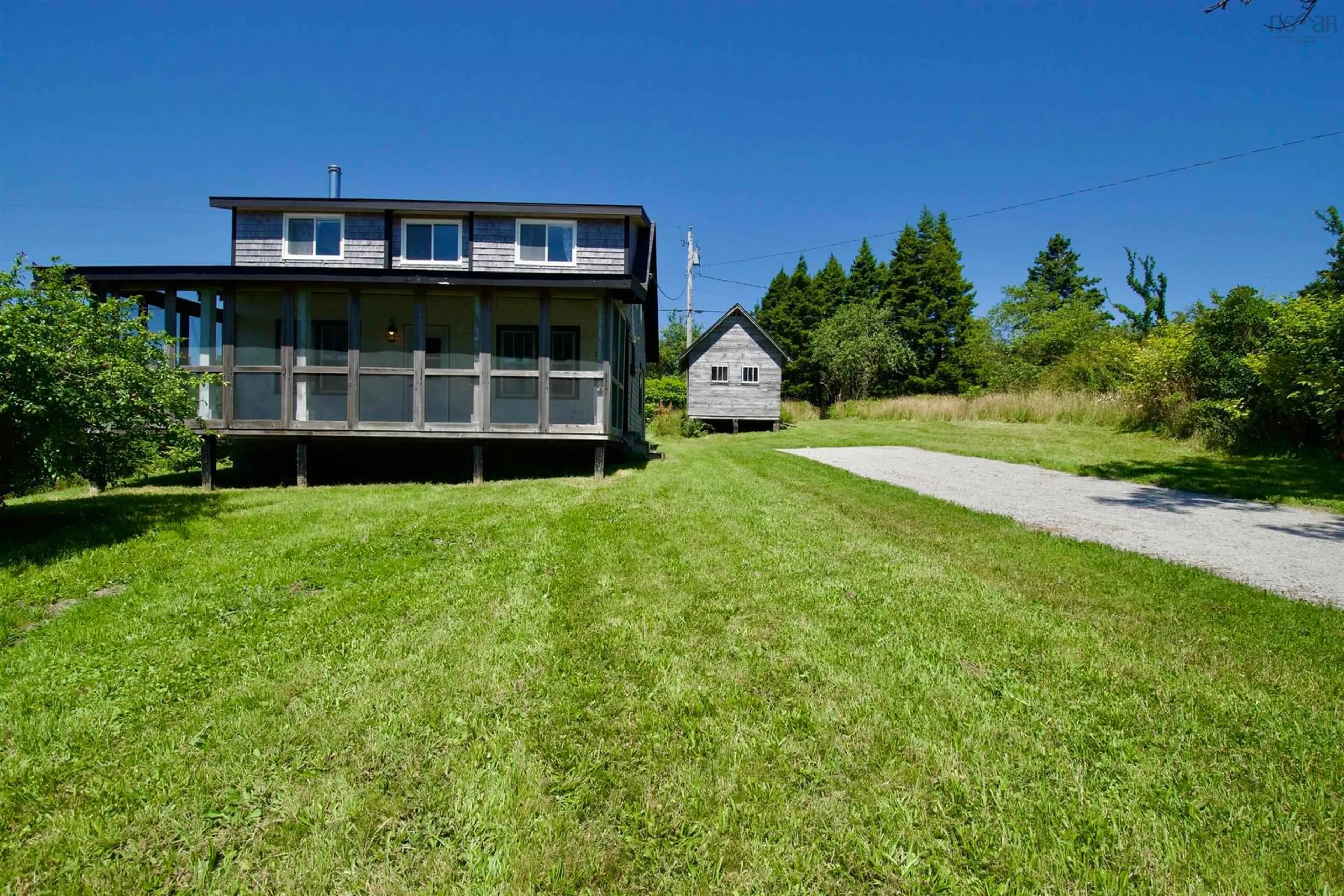 A pic from outside/outdoor area/front of a property/back of a property/a pic from drone, water/lake/river/ocean view for 2450 West Sable Rd, Little Harbour Nova Scotia B0T 1V0
