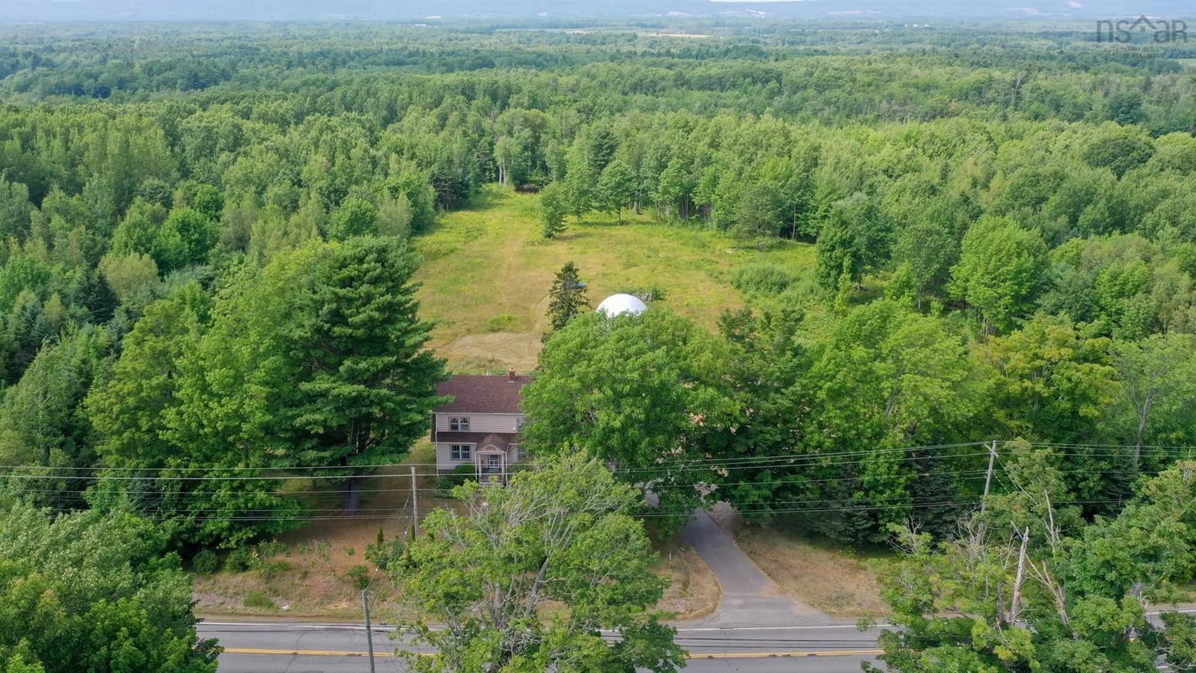 A pic from outside/outdoor area/front of a property/back of a property/a pic from drone, forest/trees view for 5065 Highway 1, Waterville Nova Scotia B0P 1V0