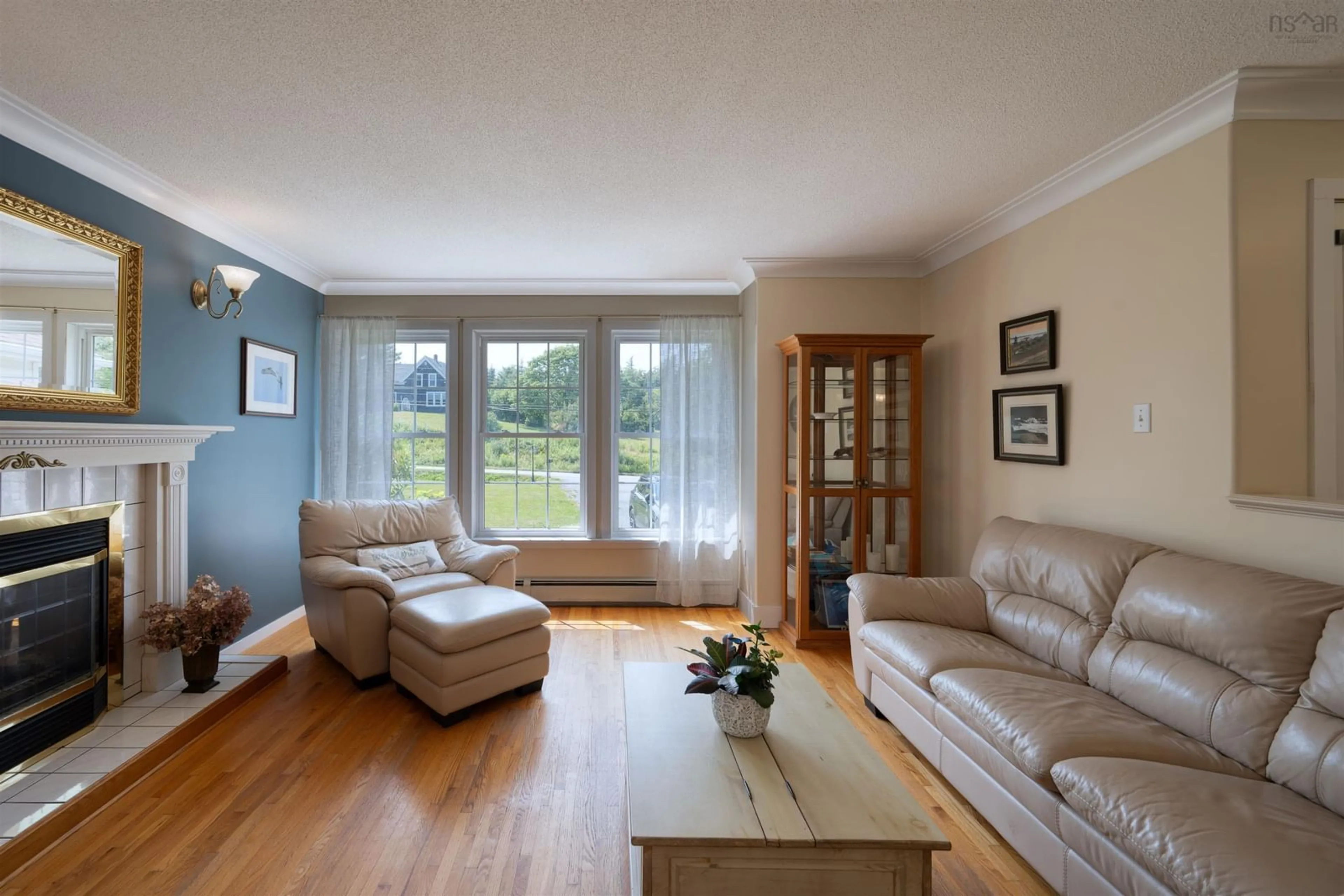 Living room with furniture, wood/laminate floor for 22034 Highway 7, Sheet Harbour Nova Scotia B0J 3B0
