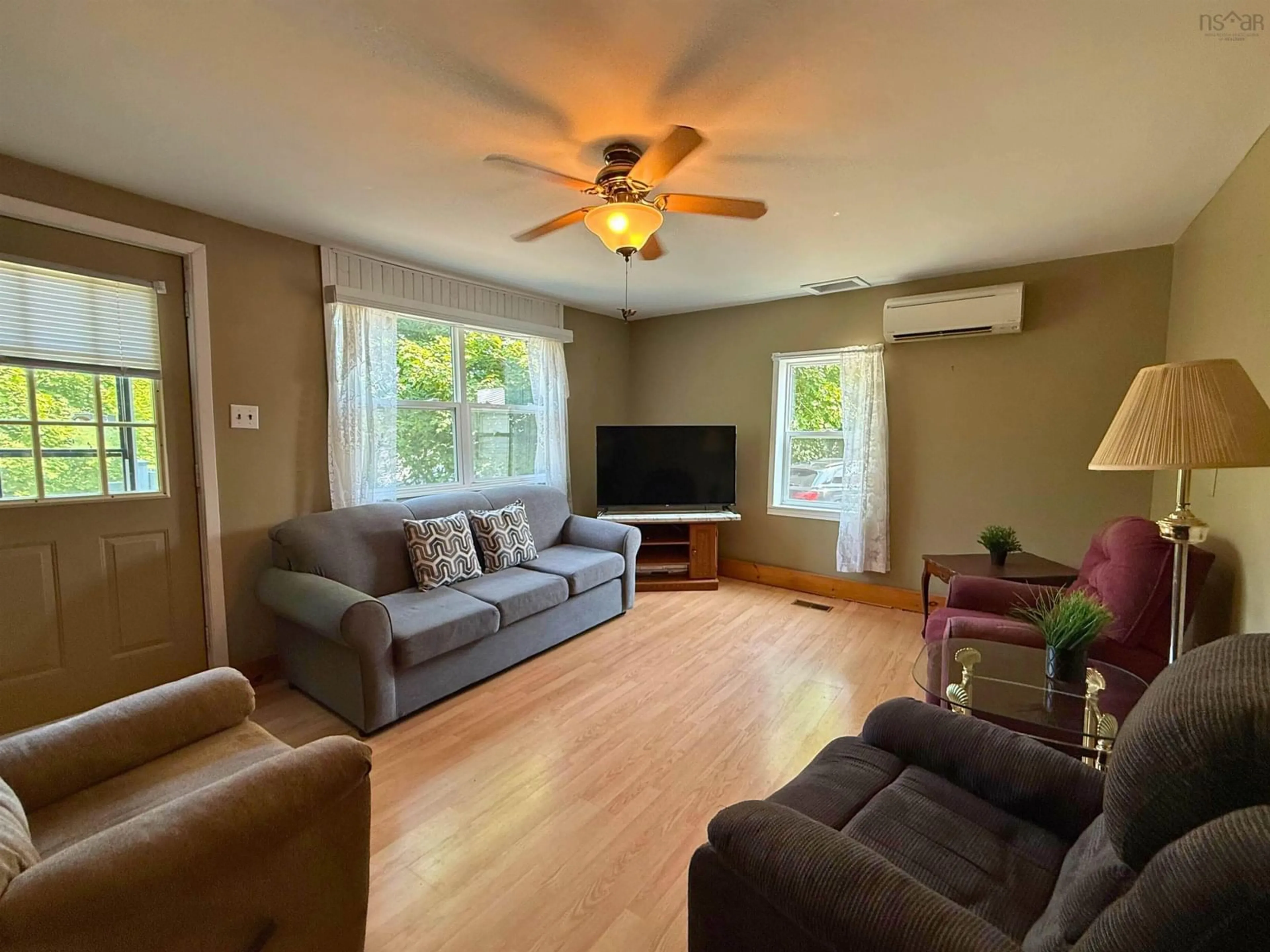 Living room with furniture, wood/laminate floor for 159 Panuke Rd, Three Mile Plains Nova Scotia B0N 2T0