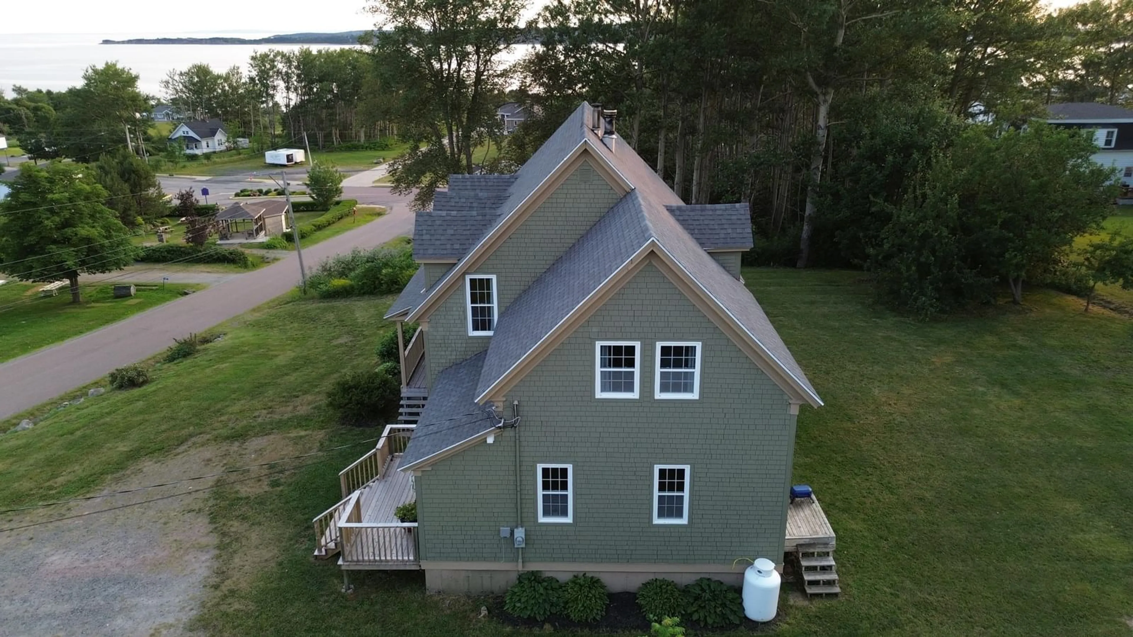 A pic from outside/outdoor area/front of a property/back of a property/a pic from drone, water/lake/river/ocean view for 21 Fraser St, Port Hood Nova Scotia B0E 2W0