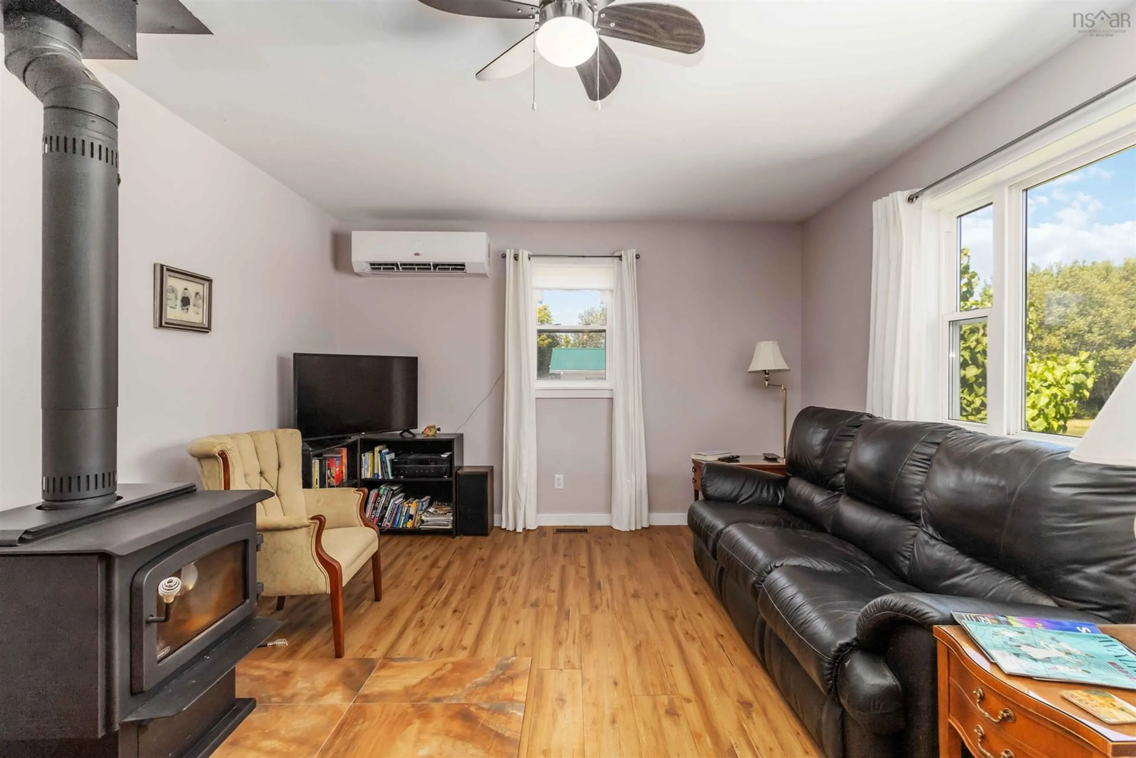 Living room with furniture, wood/laminate floor for 5451 Highway 325, Baker Settlement Nova Scotia B4V 7G1