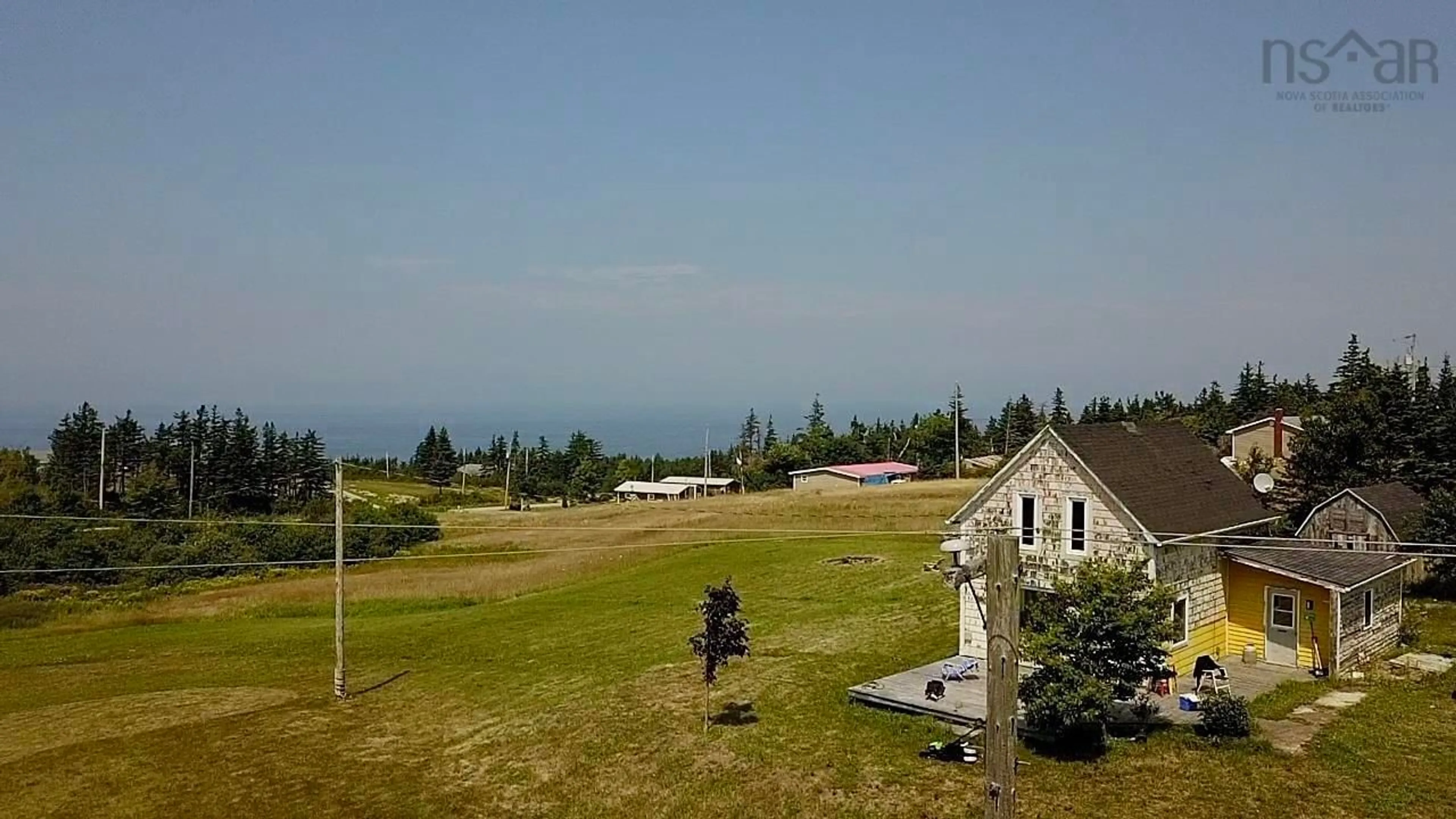 A pic from outside/outdoor area/front of a property/back of a property/a pic from drone, mountain view for 760 Foot Cape Rd, Inverness Nova Scotia B0E 1N0