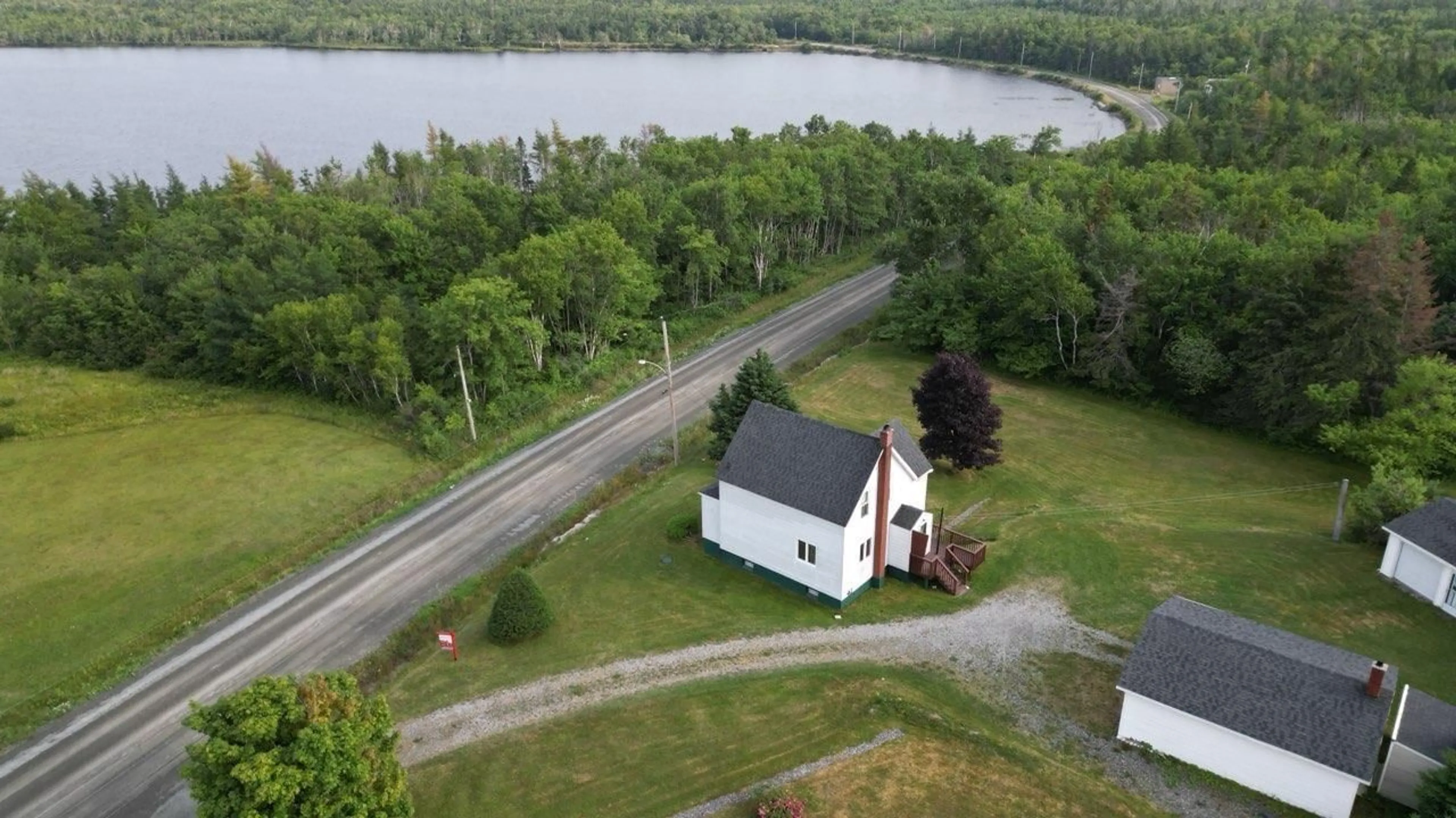A pic from outside/outdoor area/front of a property/back of a property/a pic from drone, water/lake/river/ocean view for 506 Sand Lake Rd, Tower Road Nova Scotia B1B 1J6