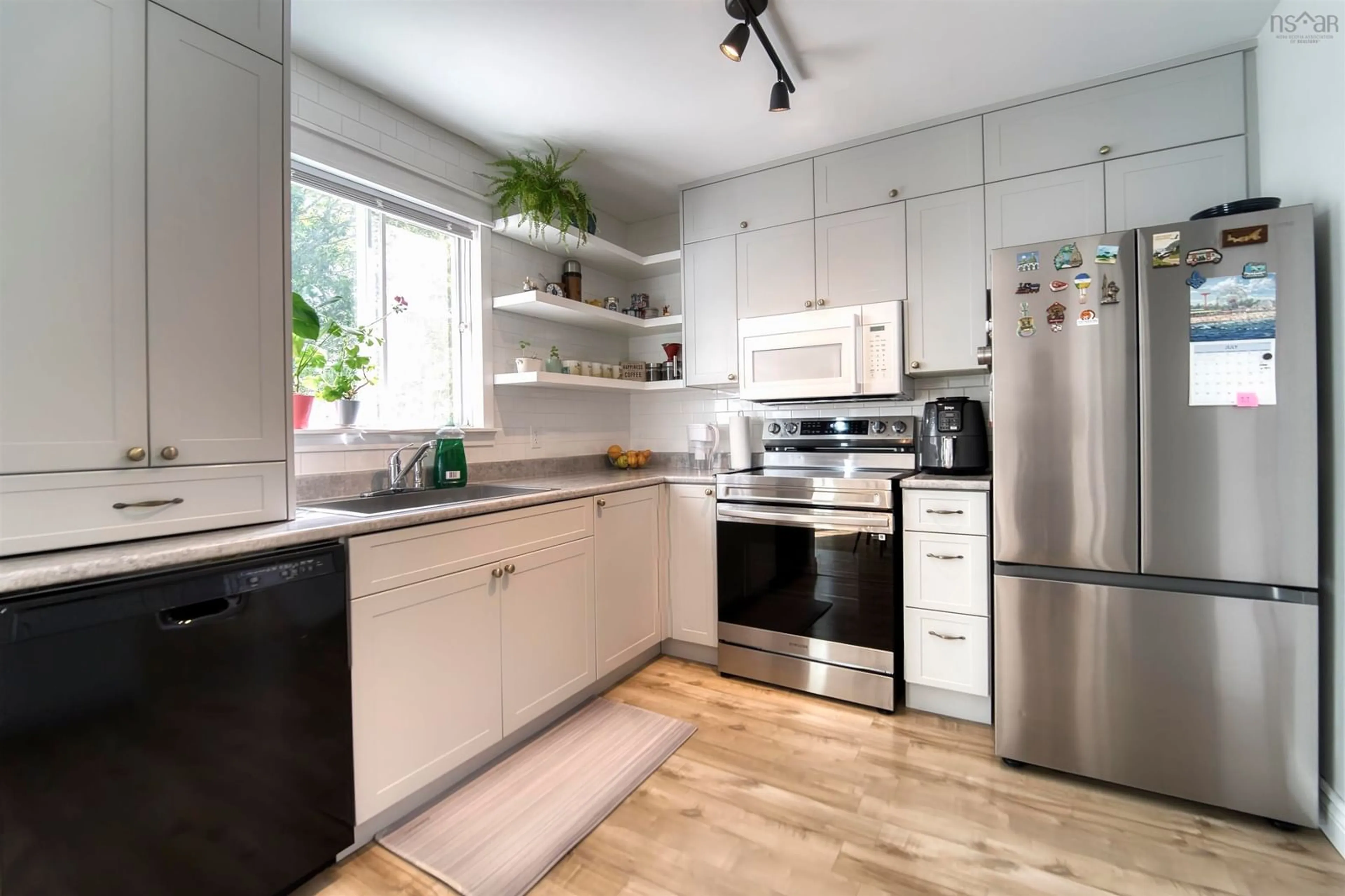 Open concept kitchen, wood/laminate floor for 73 Bruce Dr, Lower Sackville Nova Scotia B4C 3T8