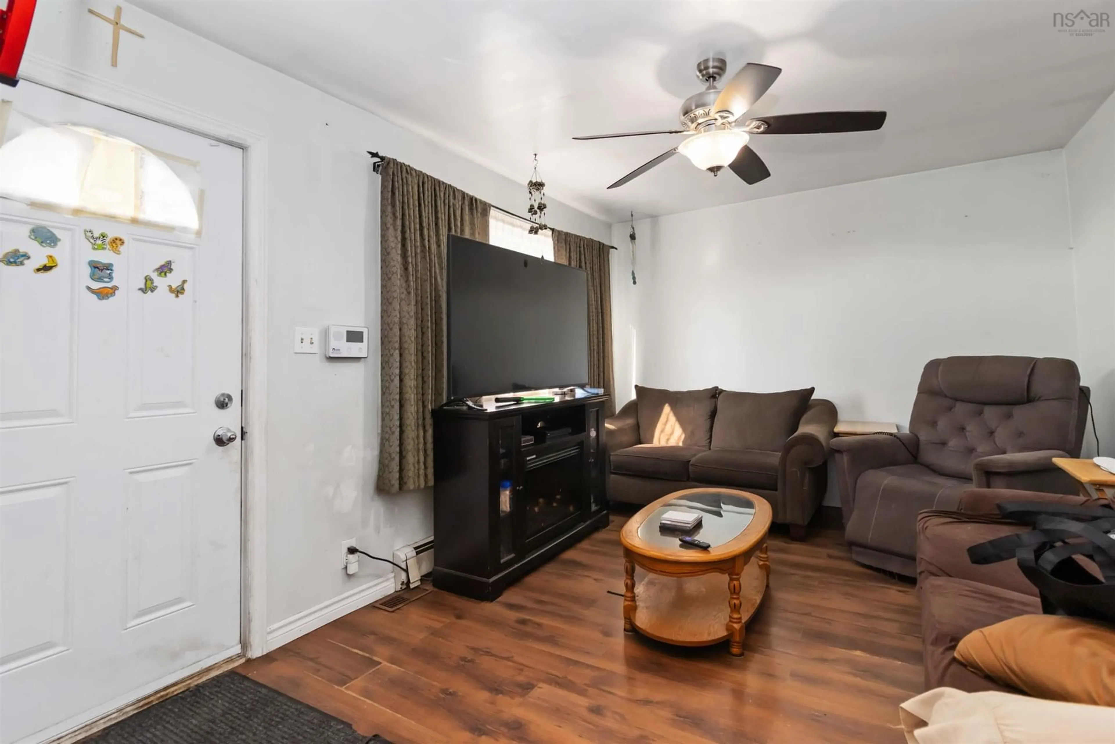 Living room with furniture, wood/laminate floor for 24 Levis St, Halifax Nova Scotia B3R 1L9