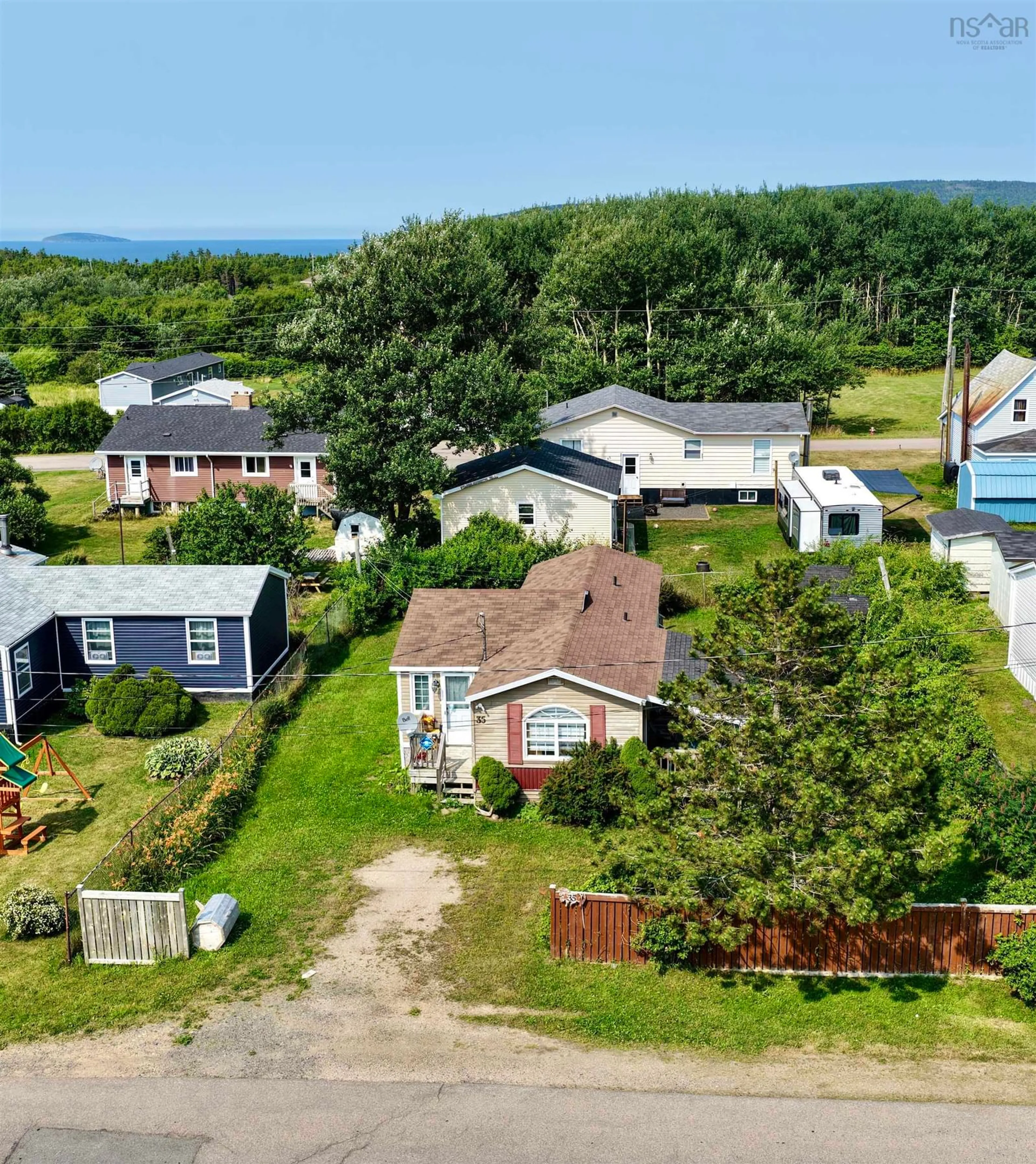 A pic from outside/outdoor area/front of a property/back of a property/a pic from drone, unknown for 35 Allan J Memorial Ave, Inverness Nova Scotia B0E 1N0