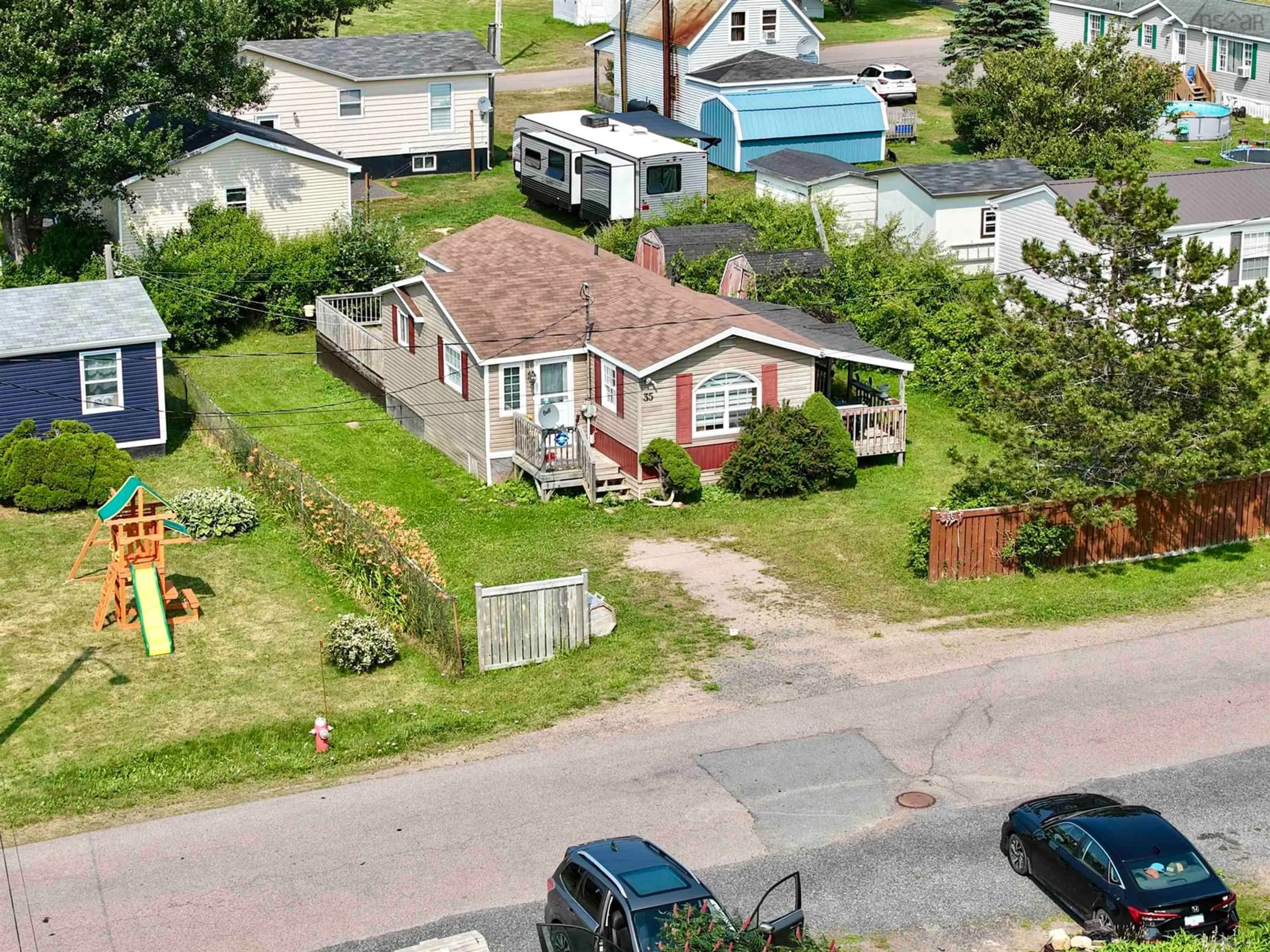 A pic from outside/outdoor area/front of a property/back of a property/a pic from drone, street for 35 Allan J Memorial Ave, Inverness Nova Scotia B0E 1N0