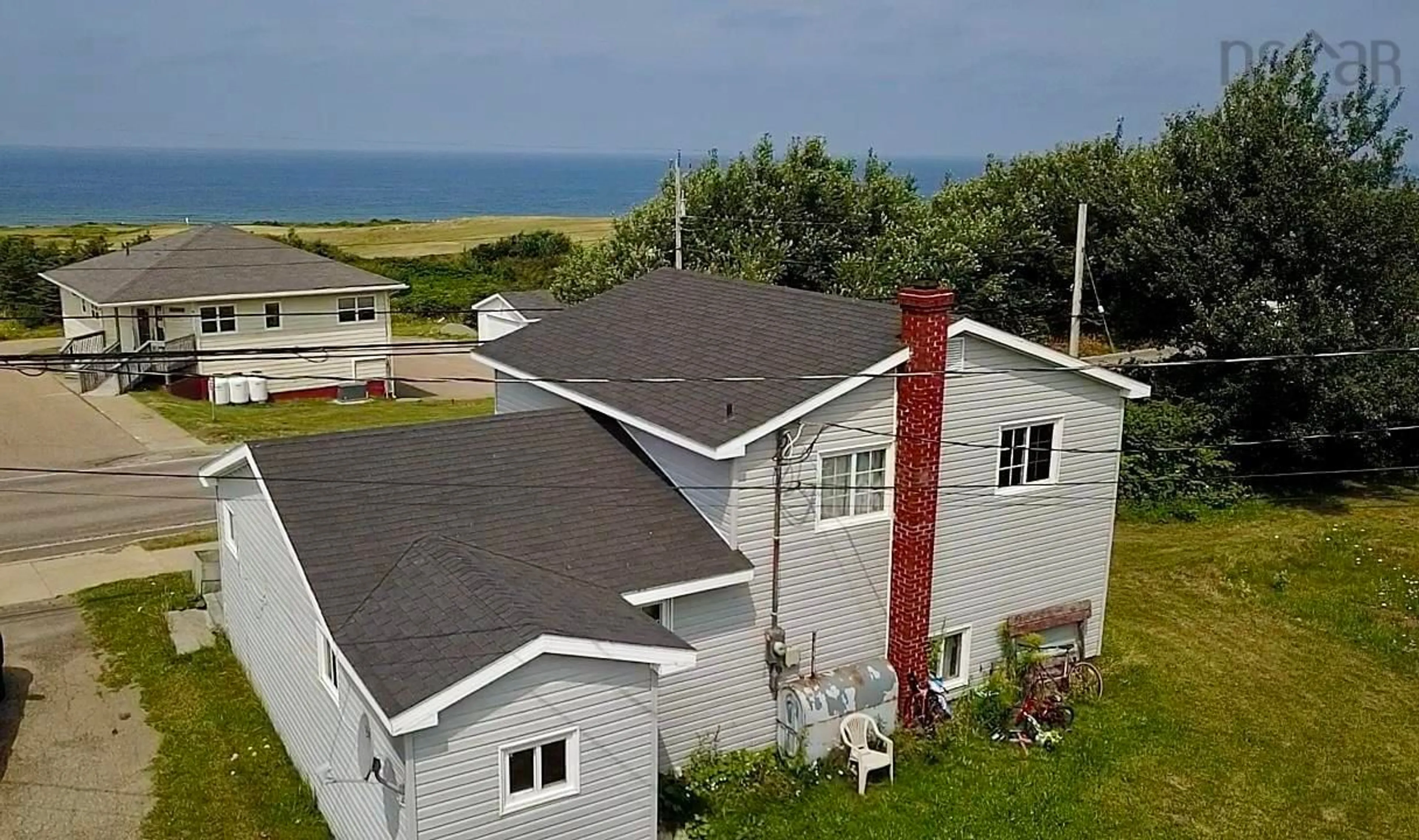 A pic from outside/outdoor area/front of a property/back of a property/a pic from drone, water/lake/river/ocean view for 15996 Central Ave, Inverness Nova Scotia B0E 1N0