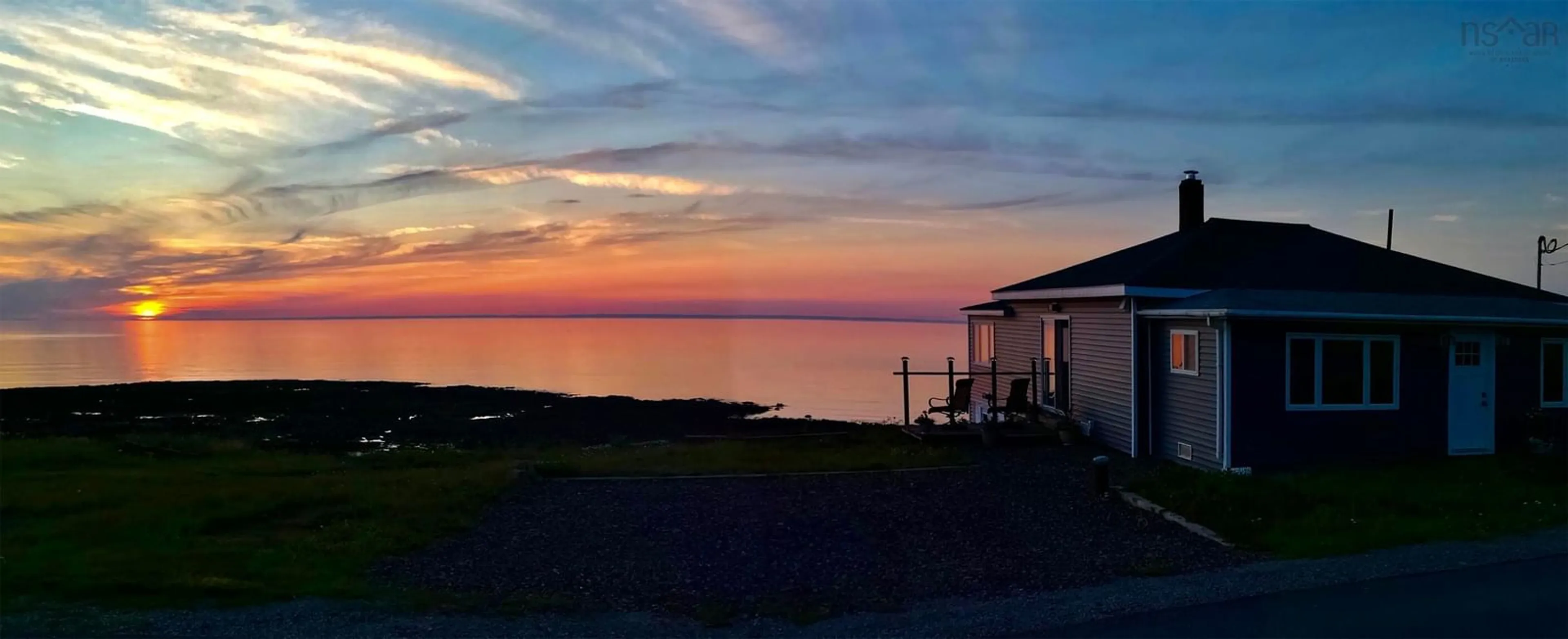 A pic from outside/outdoor area/front of a property/back of a property/a pic from drone, water/lake/river/ocean view for 12443 Shore Rd, Port George Nova Scotia B0S 1P0
