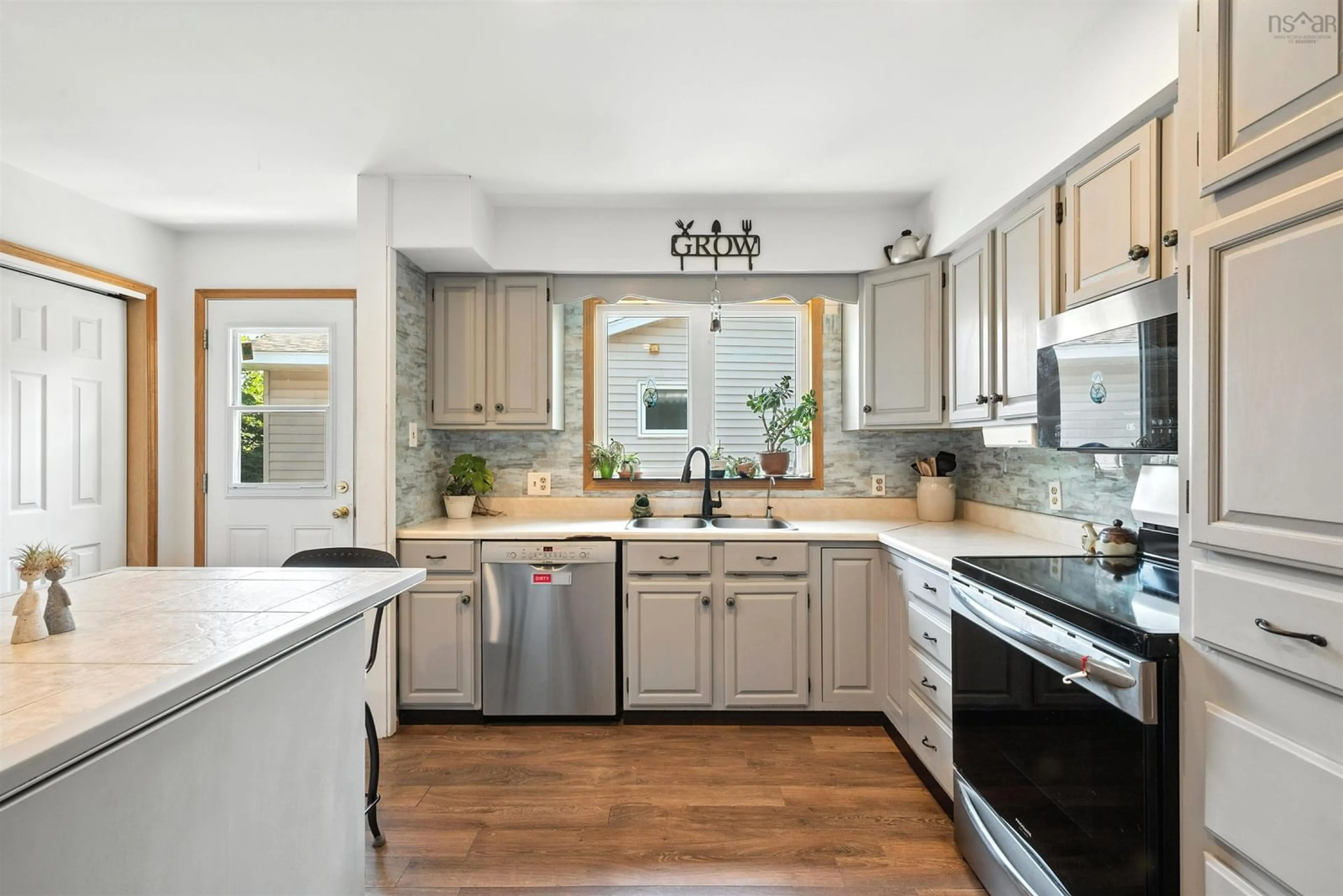 Open concept kitchen, ceramic/tile floor for 86 La Pierre Cres, Dartmouth Nova Scotia B2W 5C8