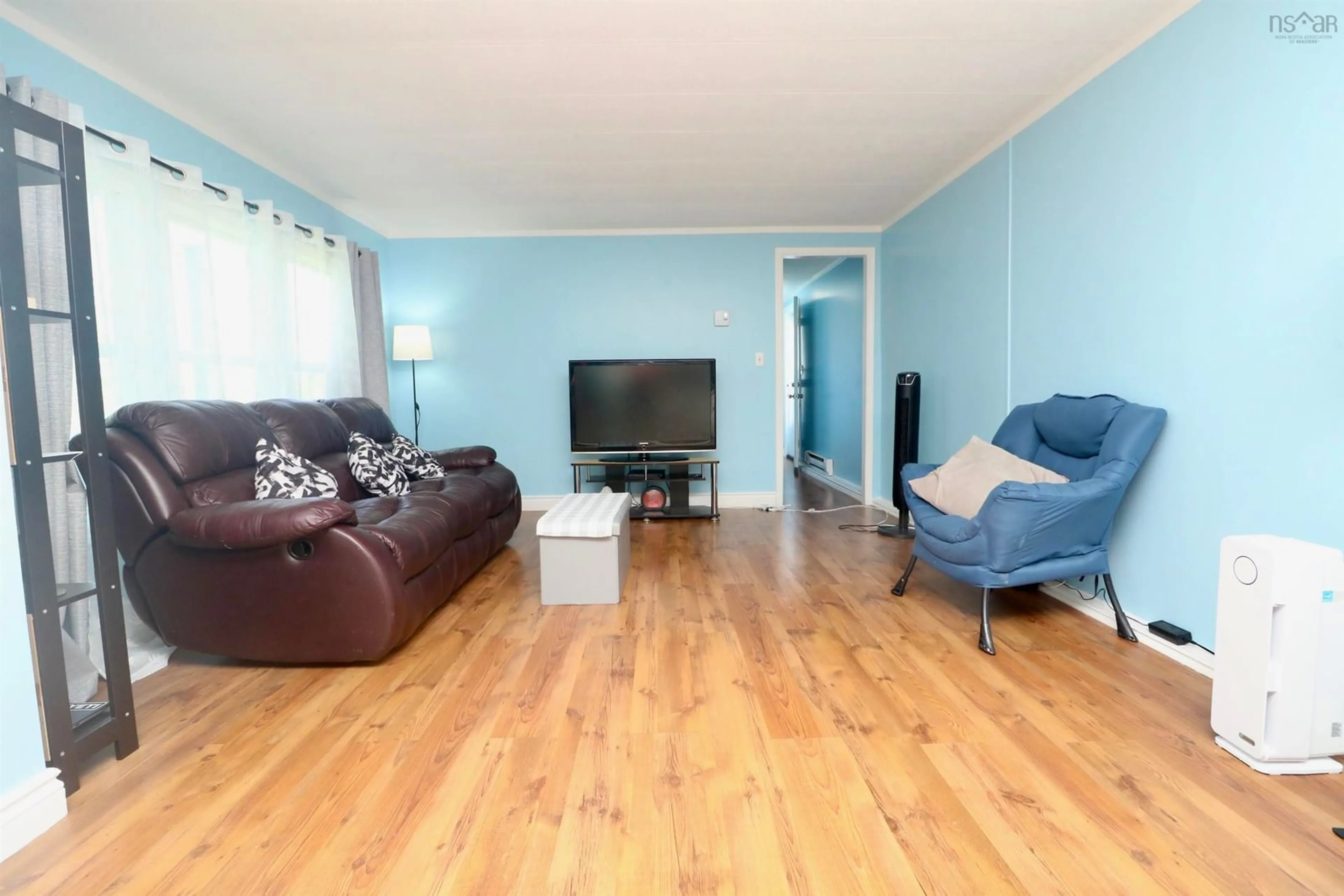 Living room with furniture, wood/laminate floor for 257 Parklane Dr, Lower Sackville Nova Scotia B4C 2X2