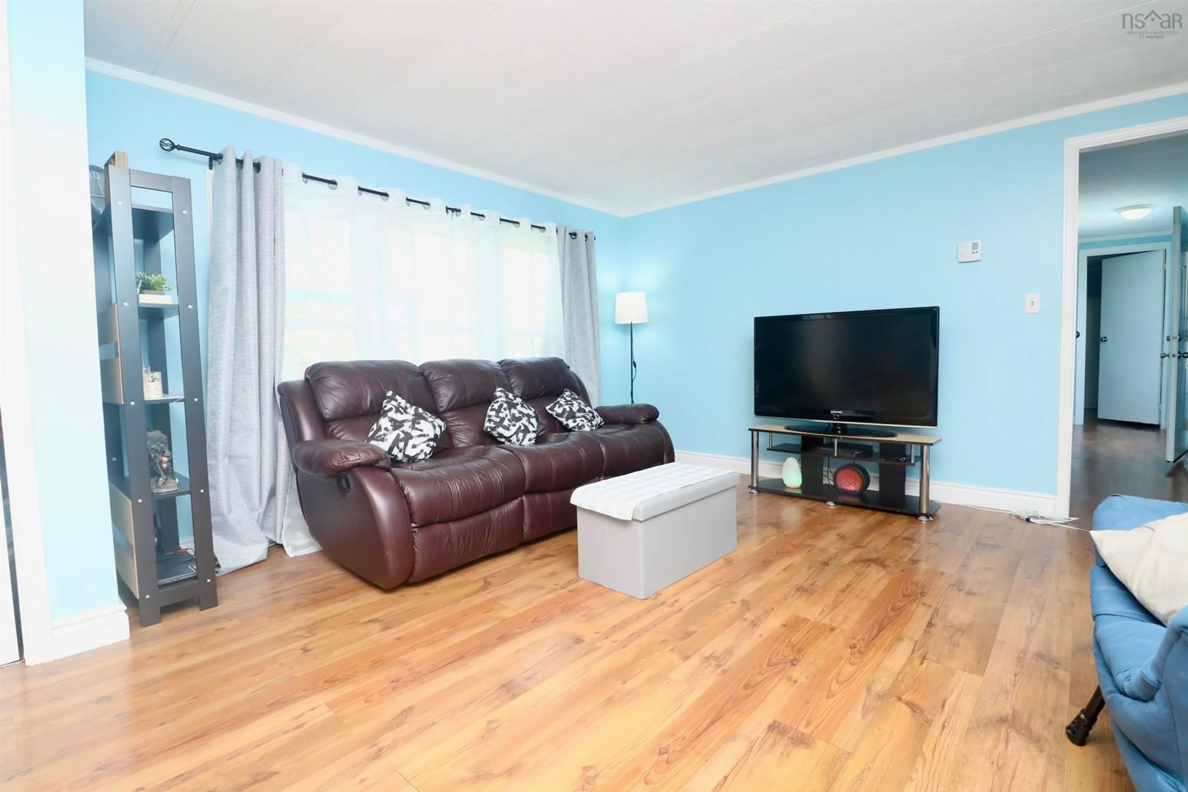 Living room with furniture, wood/laminate floor for 257 Parklane Dr, Lower Sackville Nova Scotia B4C 2X2