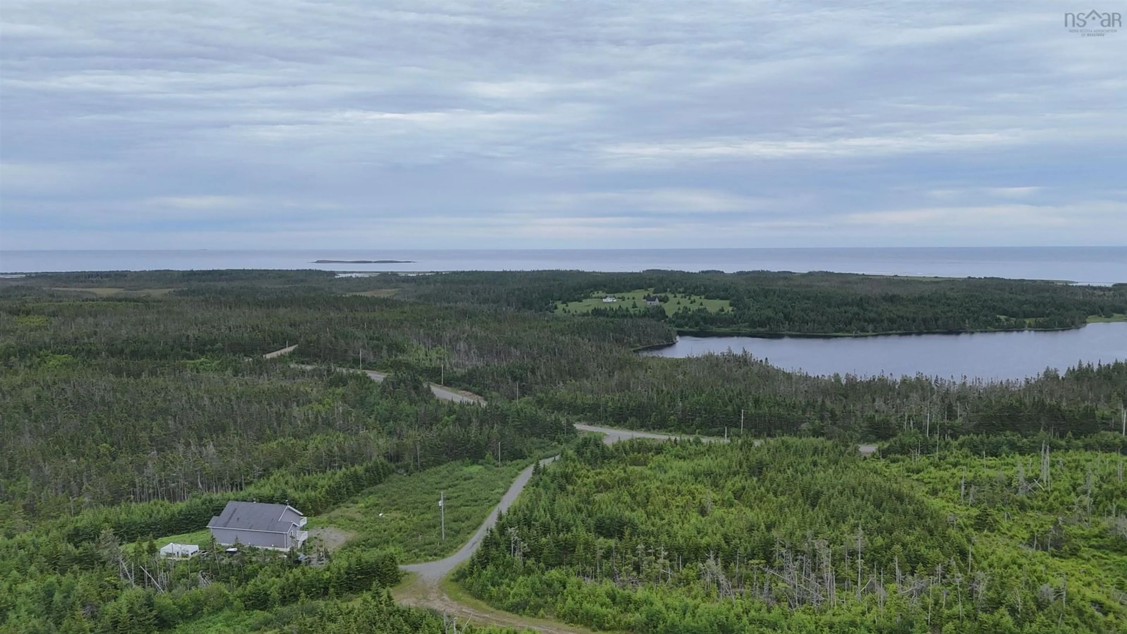 A pic from outside/outdoor area/front of a property/back of a property/a pic from drone, water/lake/river/ocean view for 4381 St. Peter's Fourchu Rd, Grand River Nova Scotia B0E 1M0