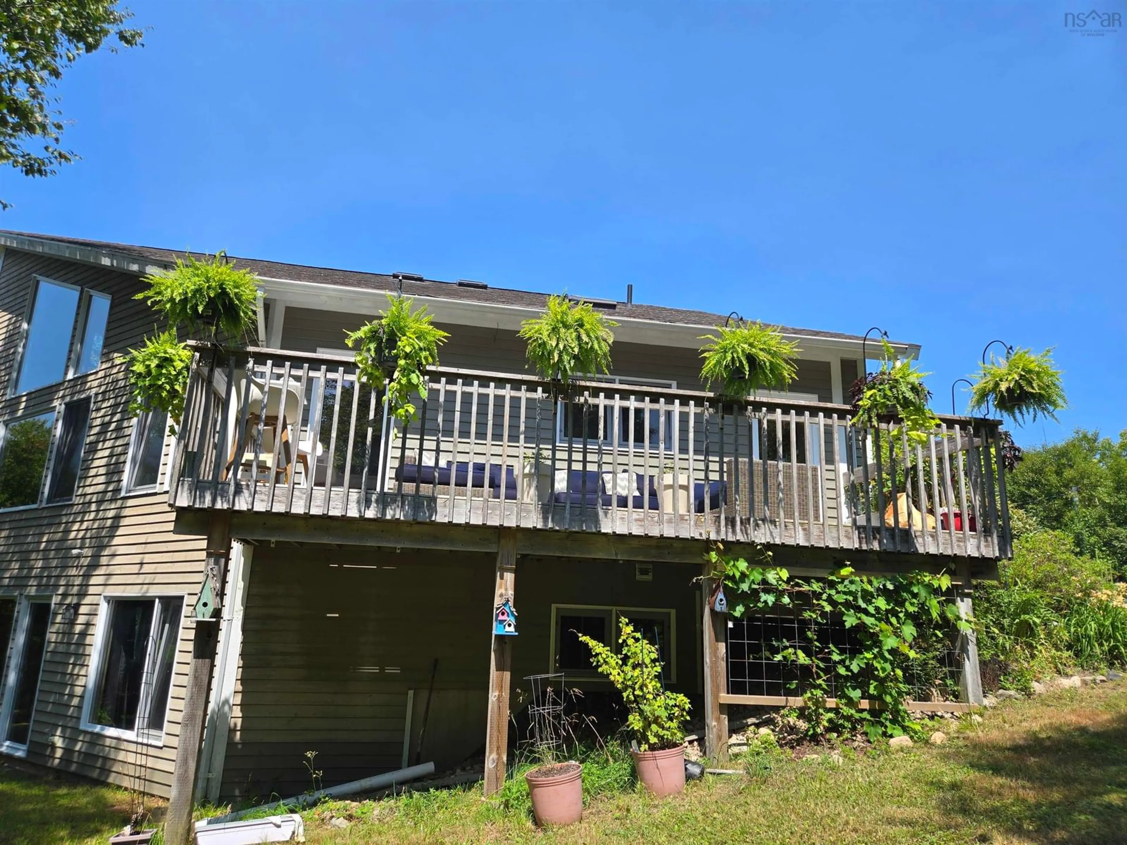 A pic from outside/outdoor area/front of a property/back of a property/a pic from drone, water/lake/river/ocean view for 55 Tweednooge Pl, East Bay Nova Scotia B1J 1M7