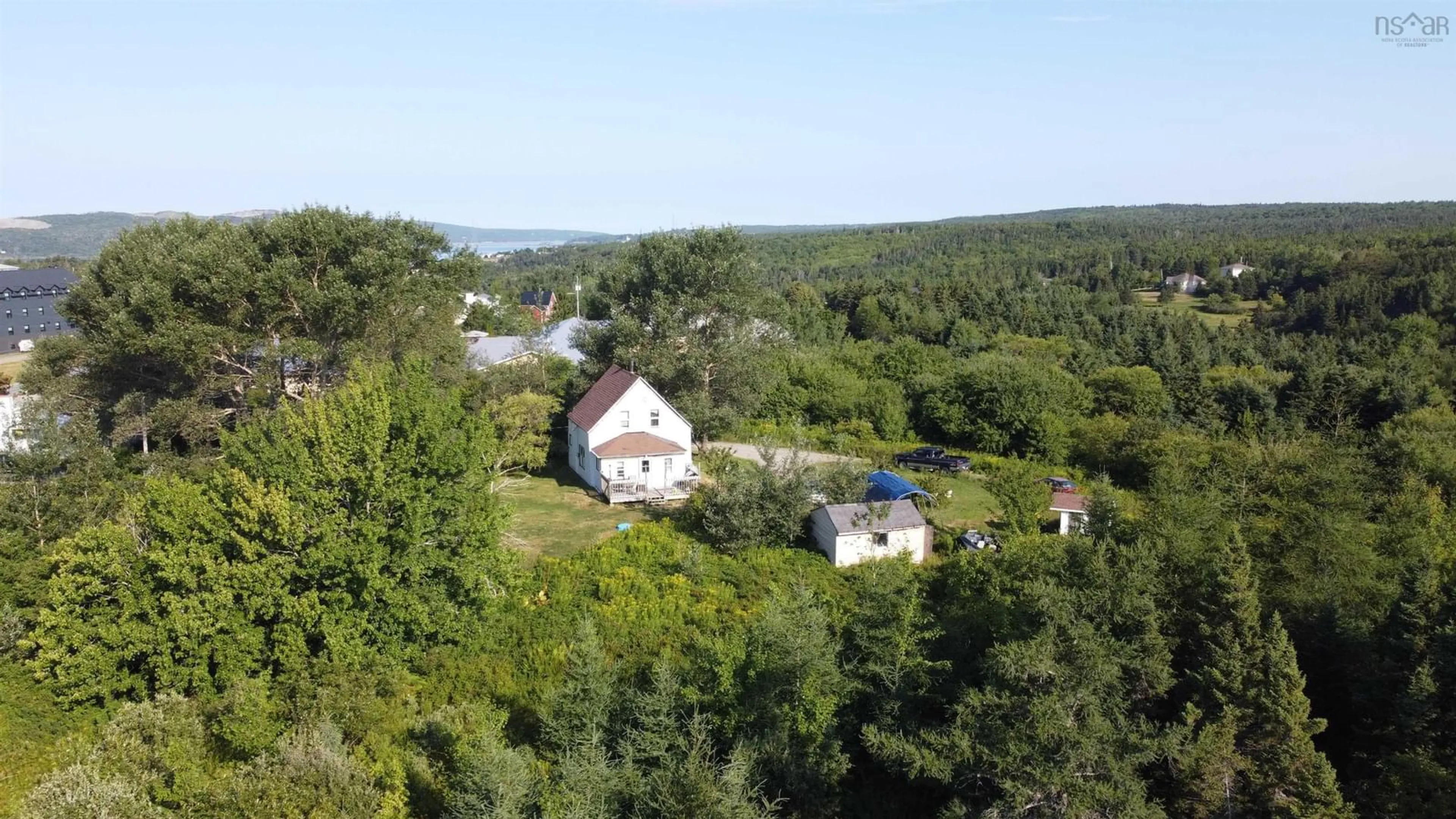 A pic from outside/outdoor area/front of a property/back of a property/a pic from drone, water/lake/river/ocean view for 6 Macquarrie Drive Exten, Port Hawkesbury Nova Scotia B9A 3S9