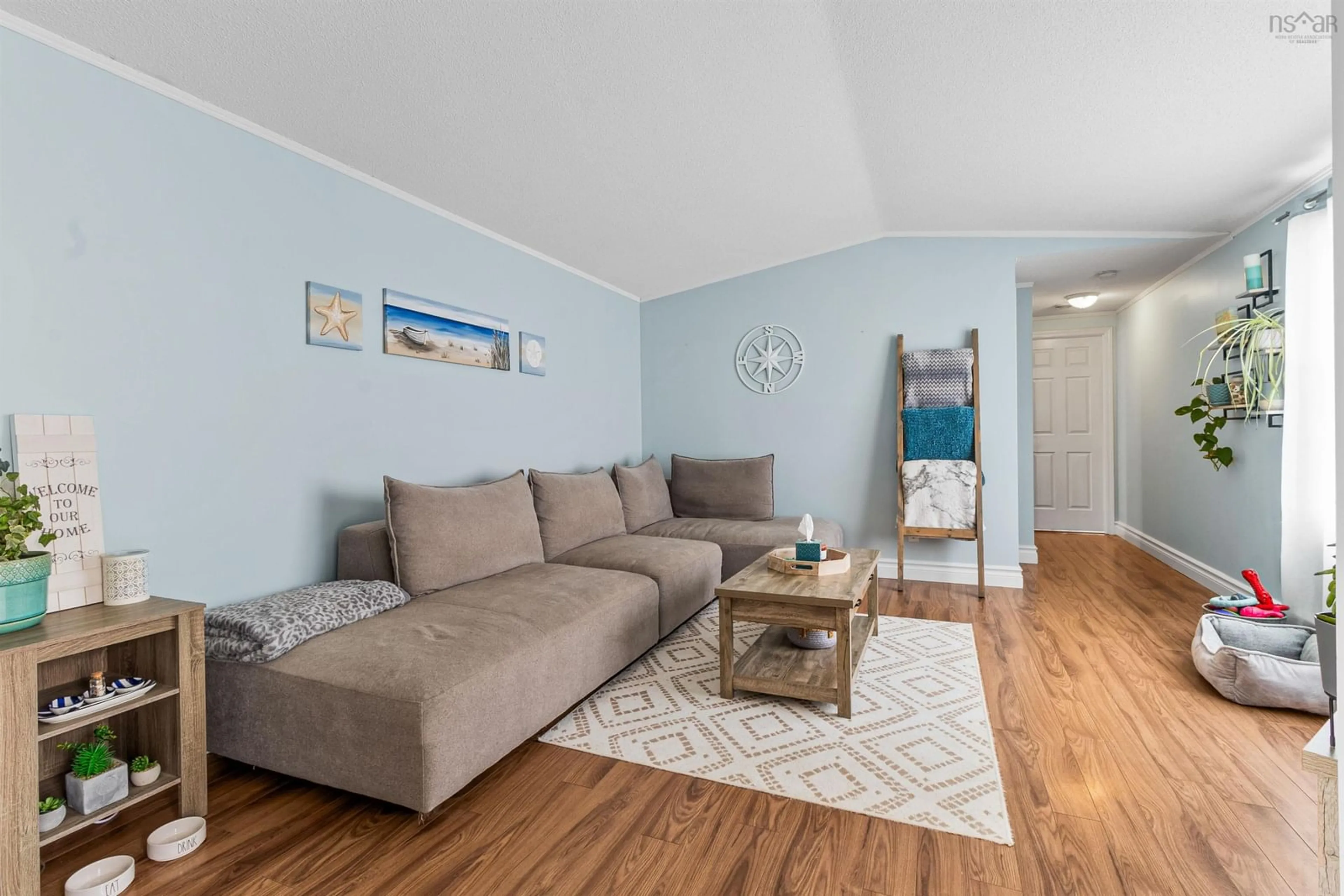 Living room with furniture, wood/laminate floor for 5 Clover Lane, Harrietsfield Nova Scotia B3V 1A7