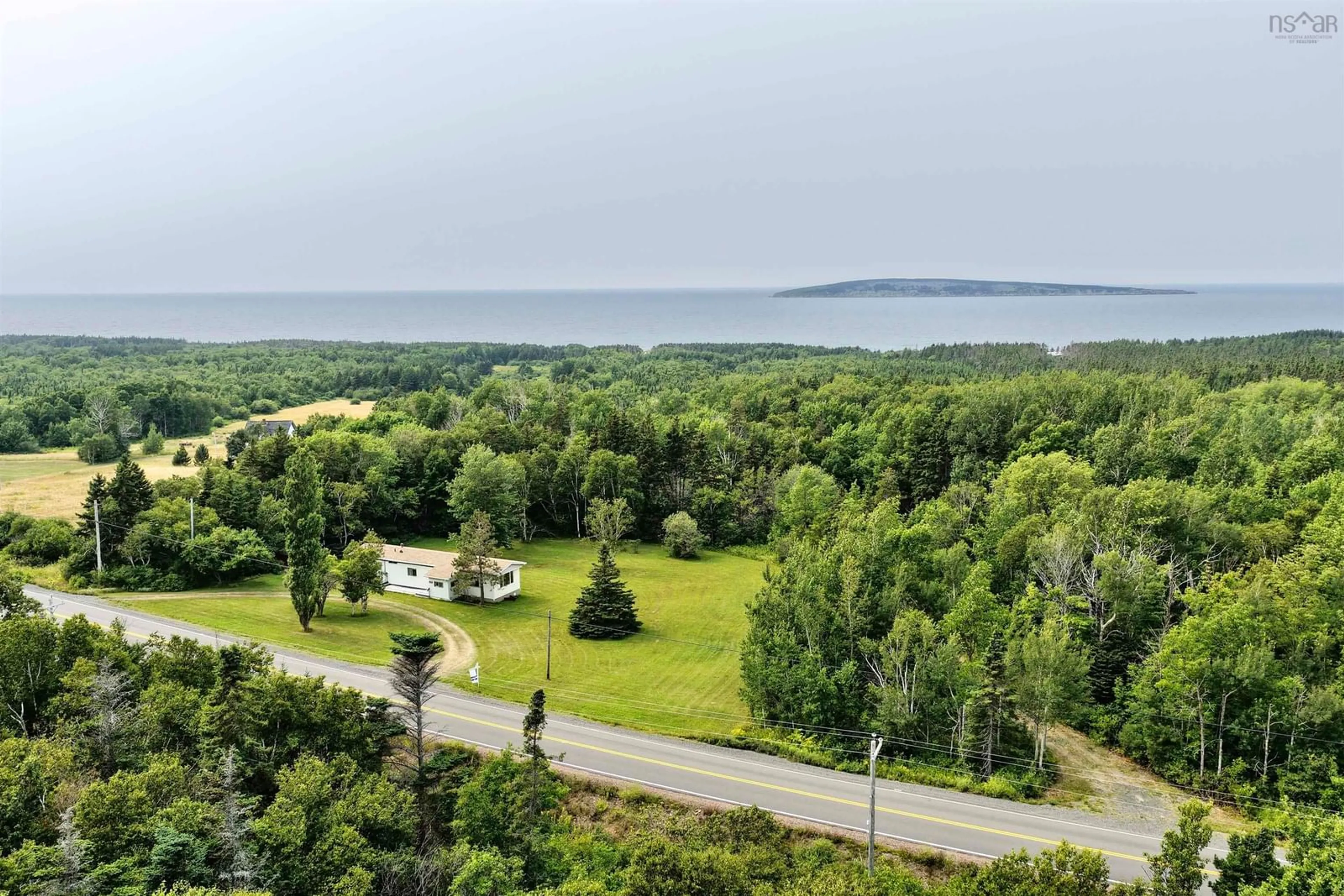 A pic from outside/outdoor area/front of a property/back of a property/a pic from drone, water/lake/river/ocean view for 743 Shore Rd, Dunvegan Nova Scotia B0E 1N0