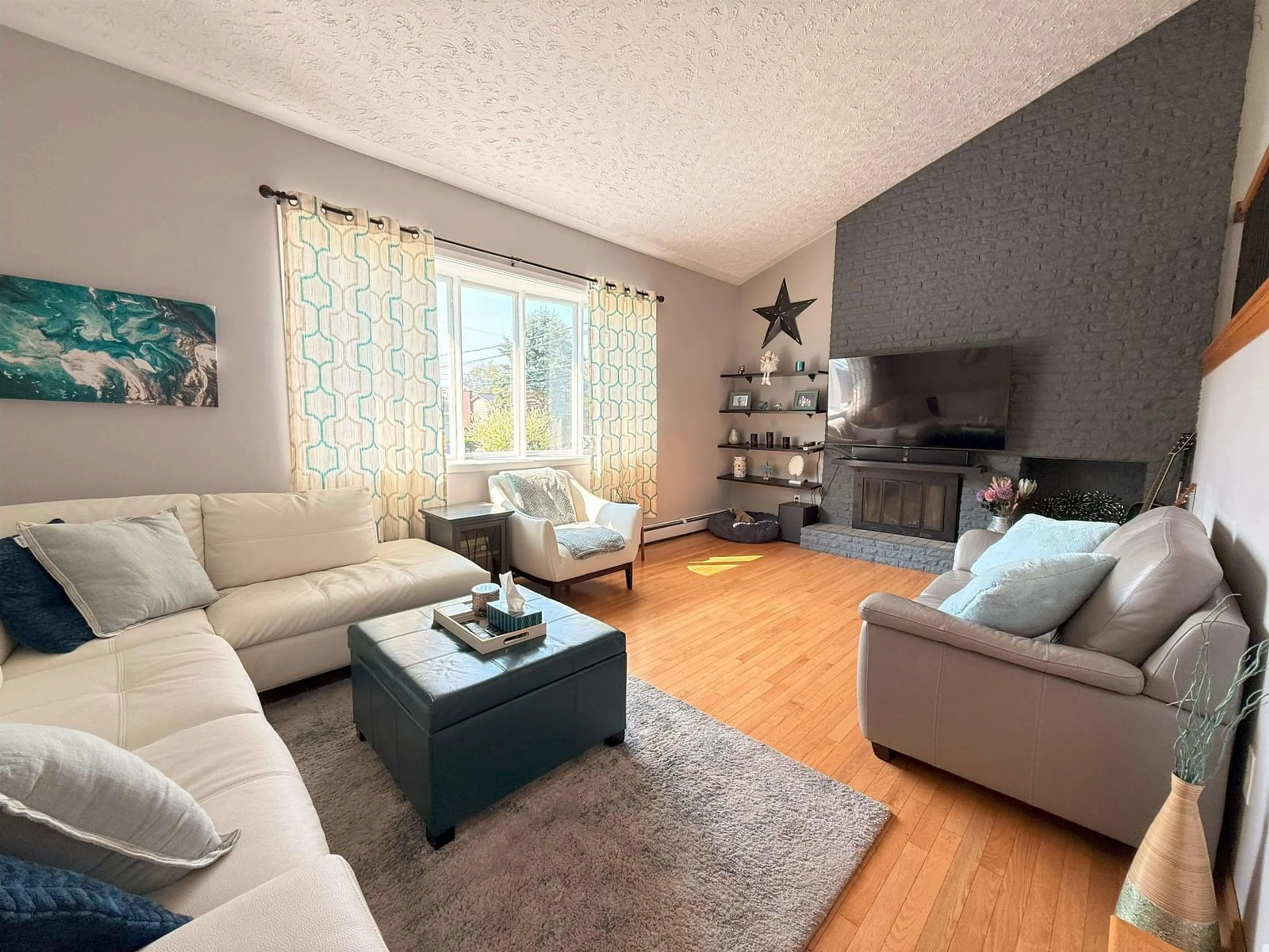 Living room with furniture, wood/laminate floor for 5 Susan Pl, Crichton Park Nova Scotia B3A 4M3