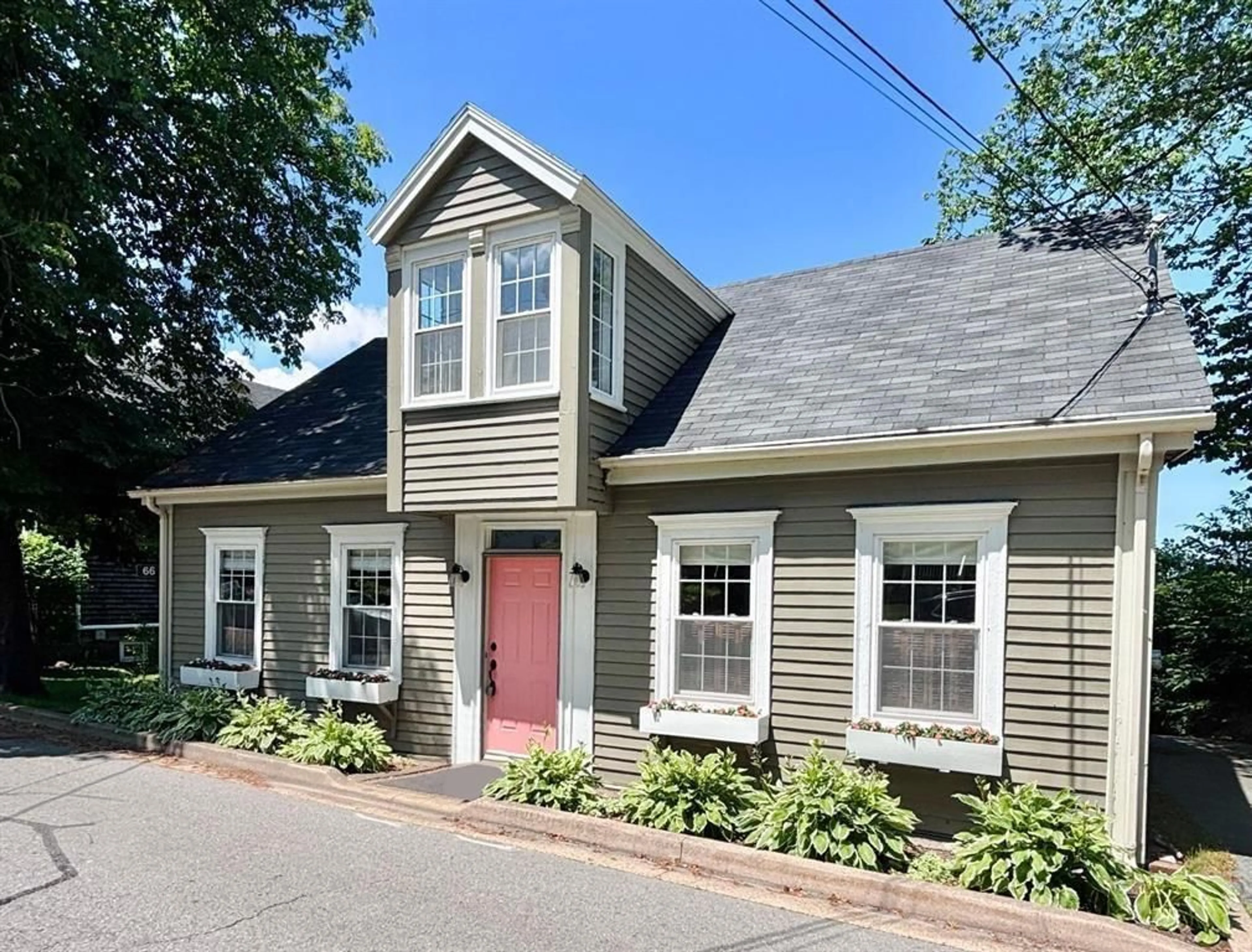 Home with vinyl exterior material, street for 66 Main St, Liverpool Nova Scotia B0T 1K0