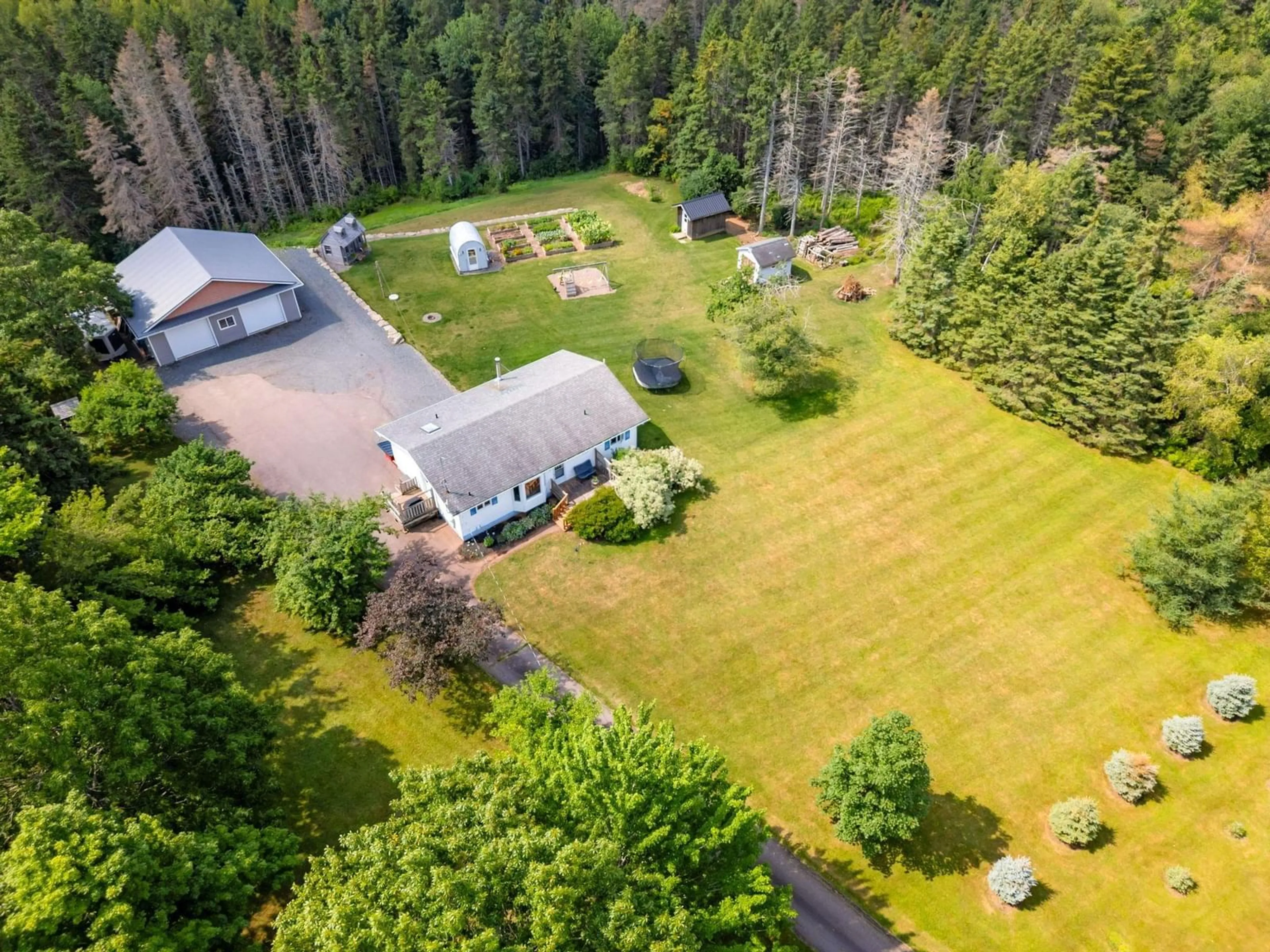 A pic from outside/outdoor area/front of a property/back of a property/a pic from drone, forest/trees view for 950 Highway 6, Bayhead Nova Scotia B0K 1V0