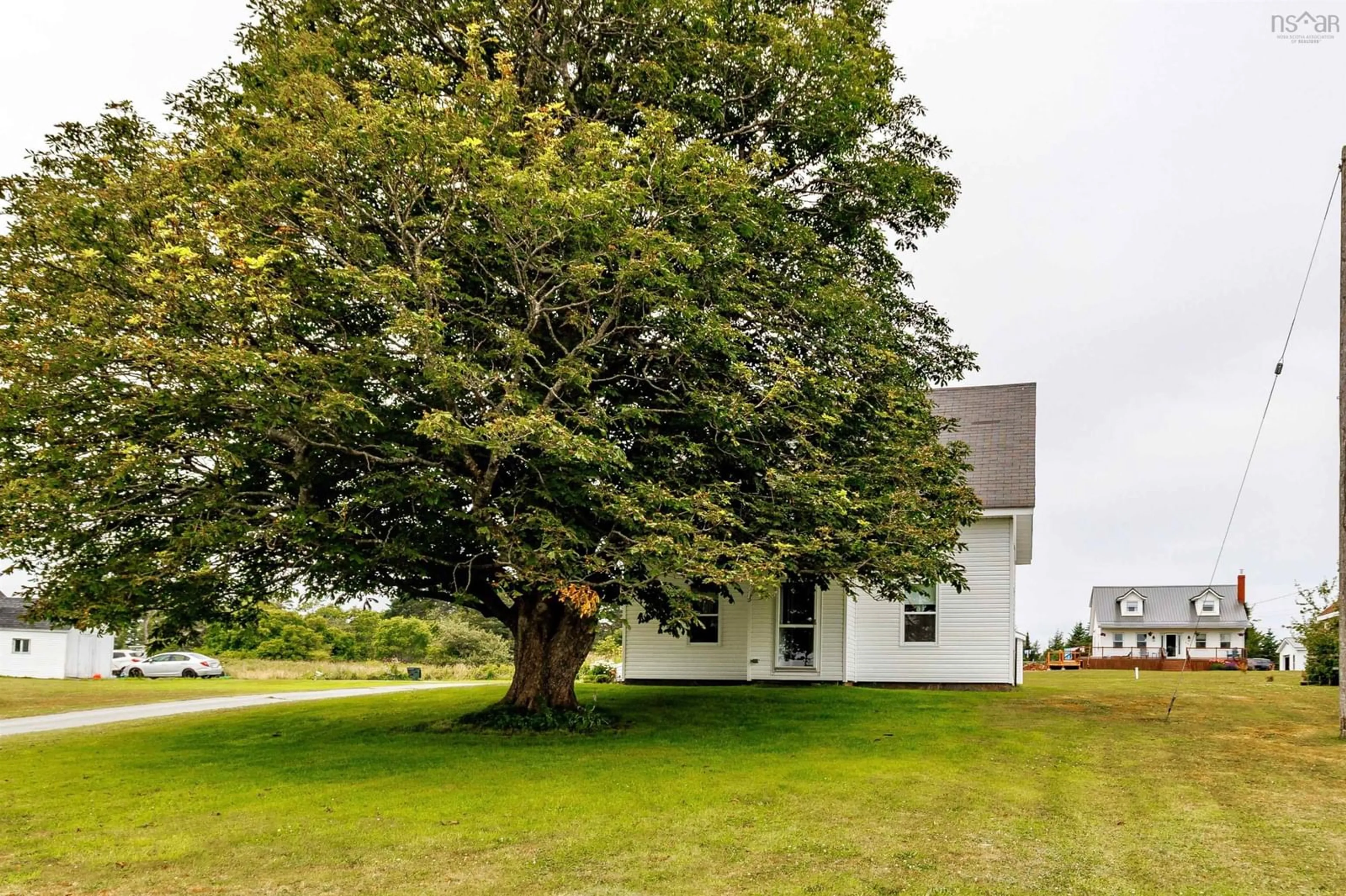 A pic from outside/outdoor area/front of a property/back of a property/a pic from drone, unknown for 684 Highway 335 Hwy, West Pubnico Nova Scotia B0W 3S0