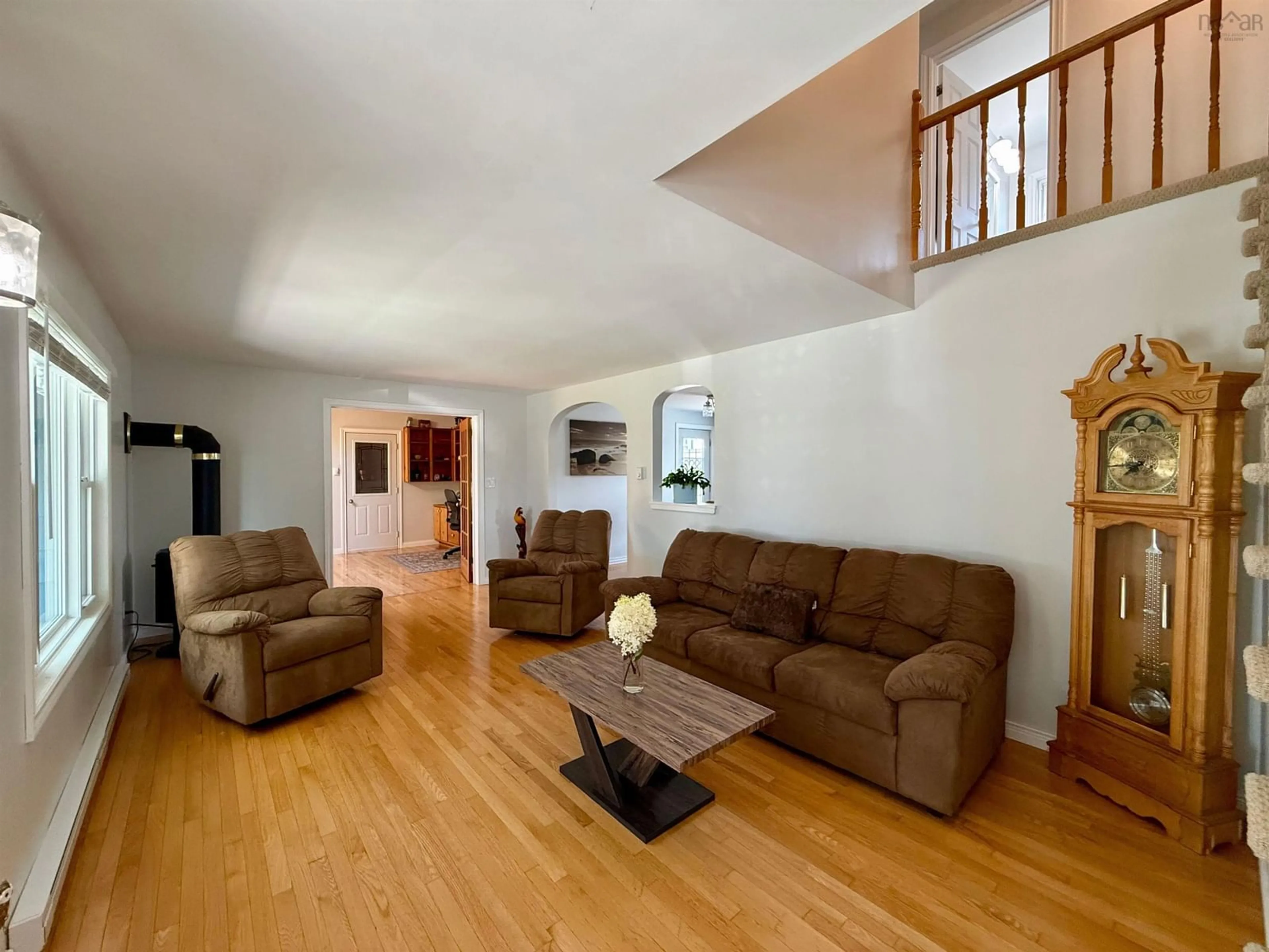 Living room with furniture, wood/laminate floor for 20 Parade St, Yarmouth Nova Scotia B5A 3A4
