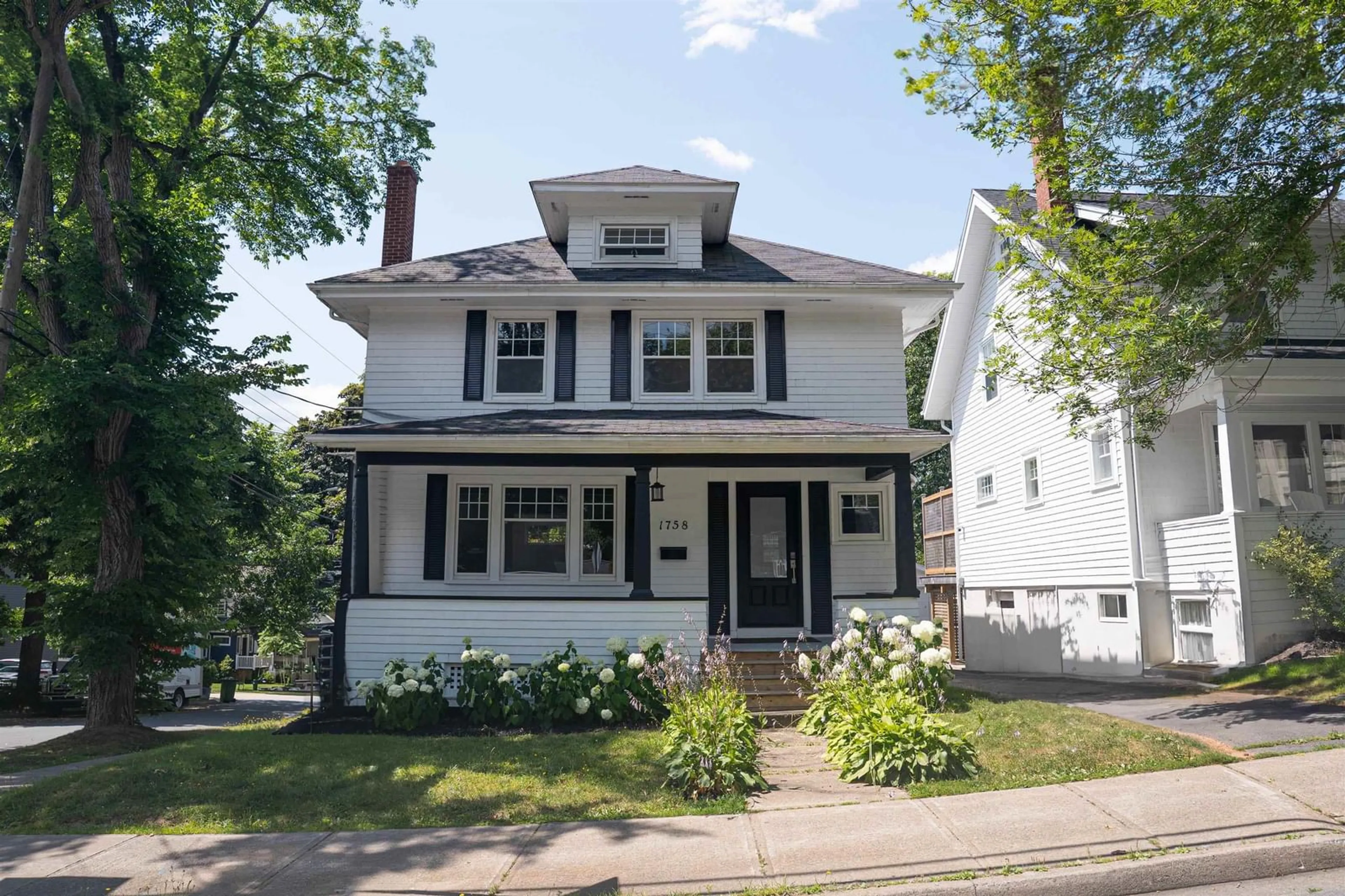 Home with vinyl exterior material, street for 1758 Preston St, Halifax Nova Scotia B3H 3V6