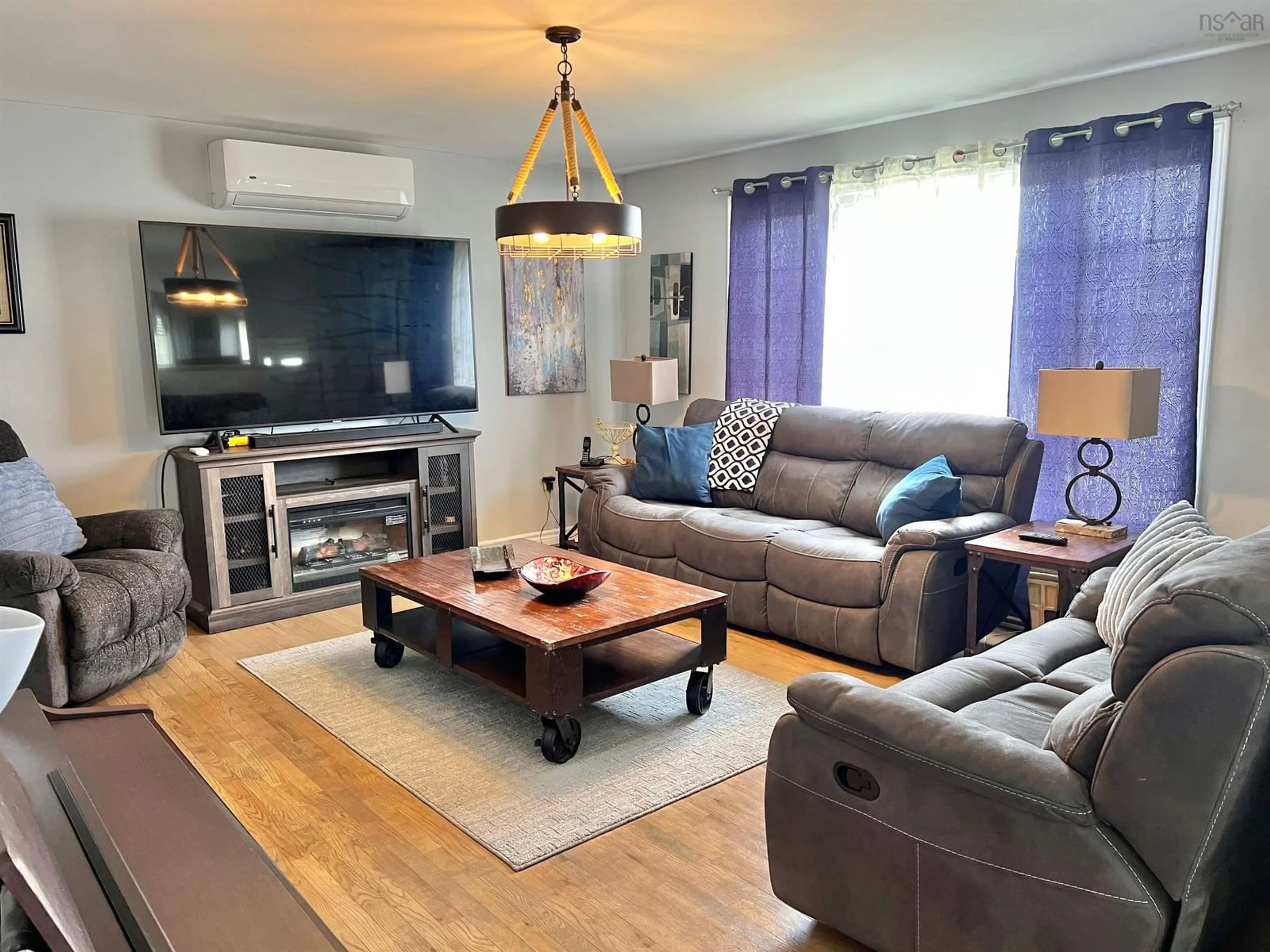 Living room with furniture, wood/laminate floor for 485 Brunswick St, Yarmouth Nova Scotia B5A 4V5
