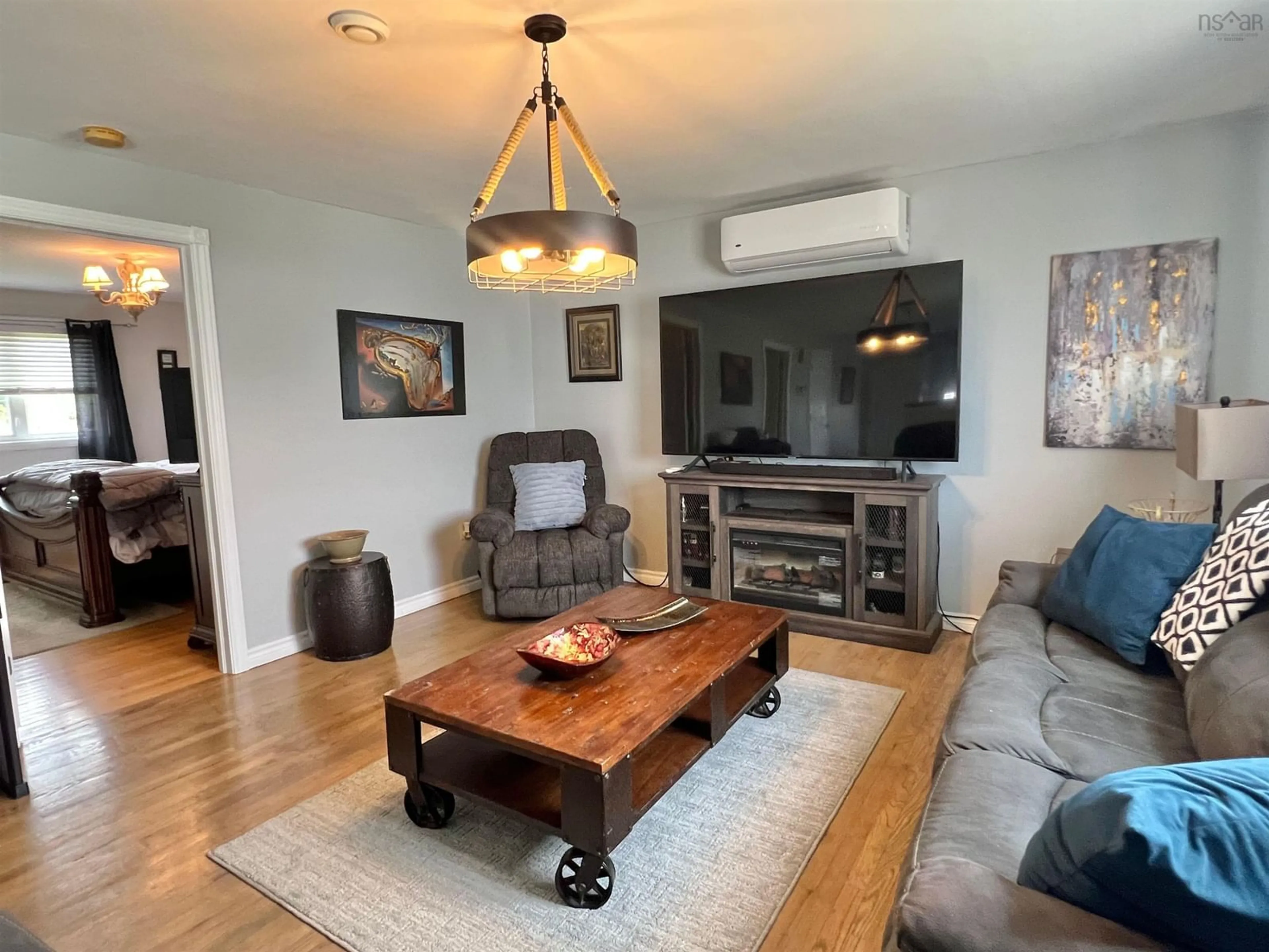 Living room with furniture, wood/laminate floor for 485 Brunswick St, Yarmouth Nova Scotia B5A 4V5