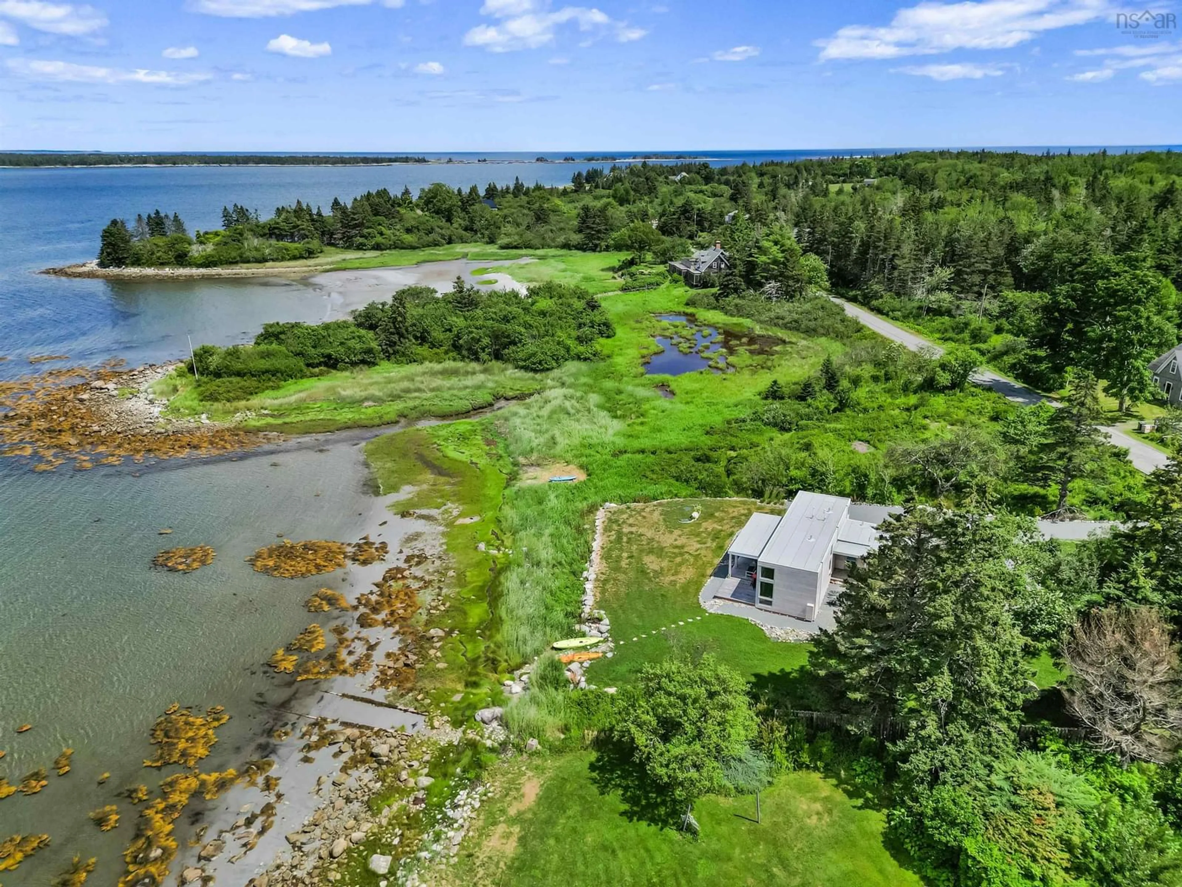 A pic from outside/outdoor area/front of a property/back of a property/a pic from drone, water/lake/river/ocean view for 325 Long Cove Rd, Port Medway Nova Scotia B0S 2T0