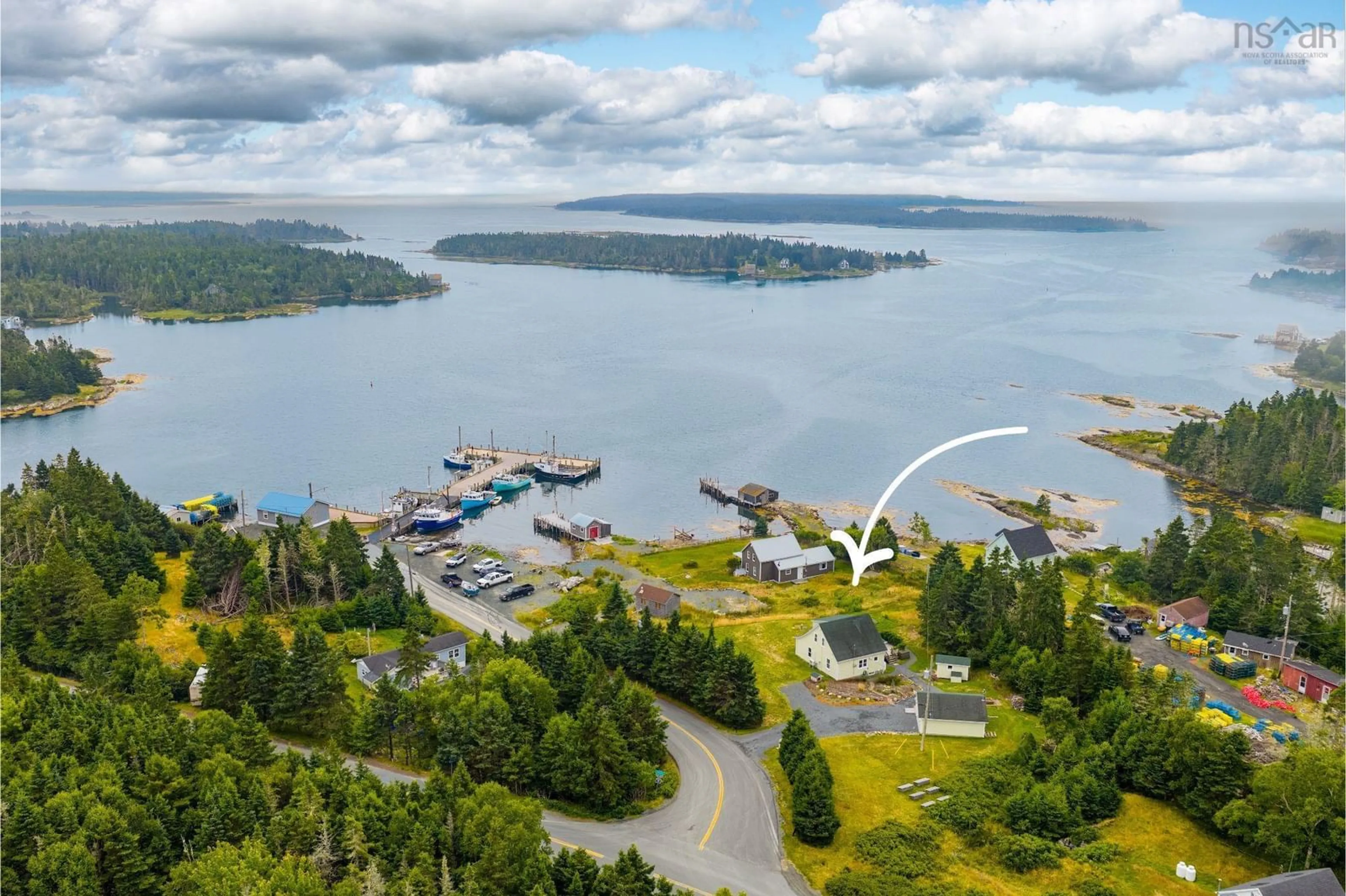 A pic from outside/outdoor area/front of a property/back of a property/a pic from drone, water/lake/river/ocean view for 28 Wharf Road, Bush Island Nova Scotia B0R 1C0