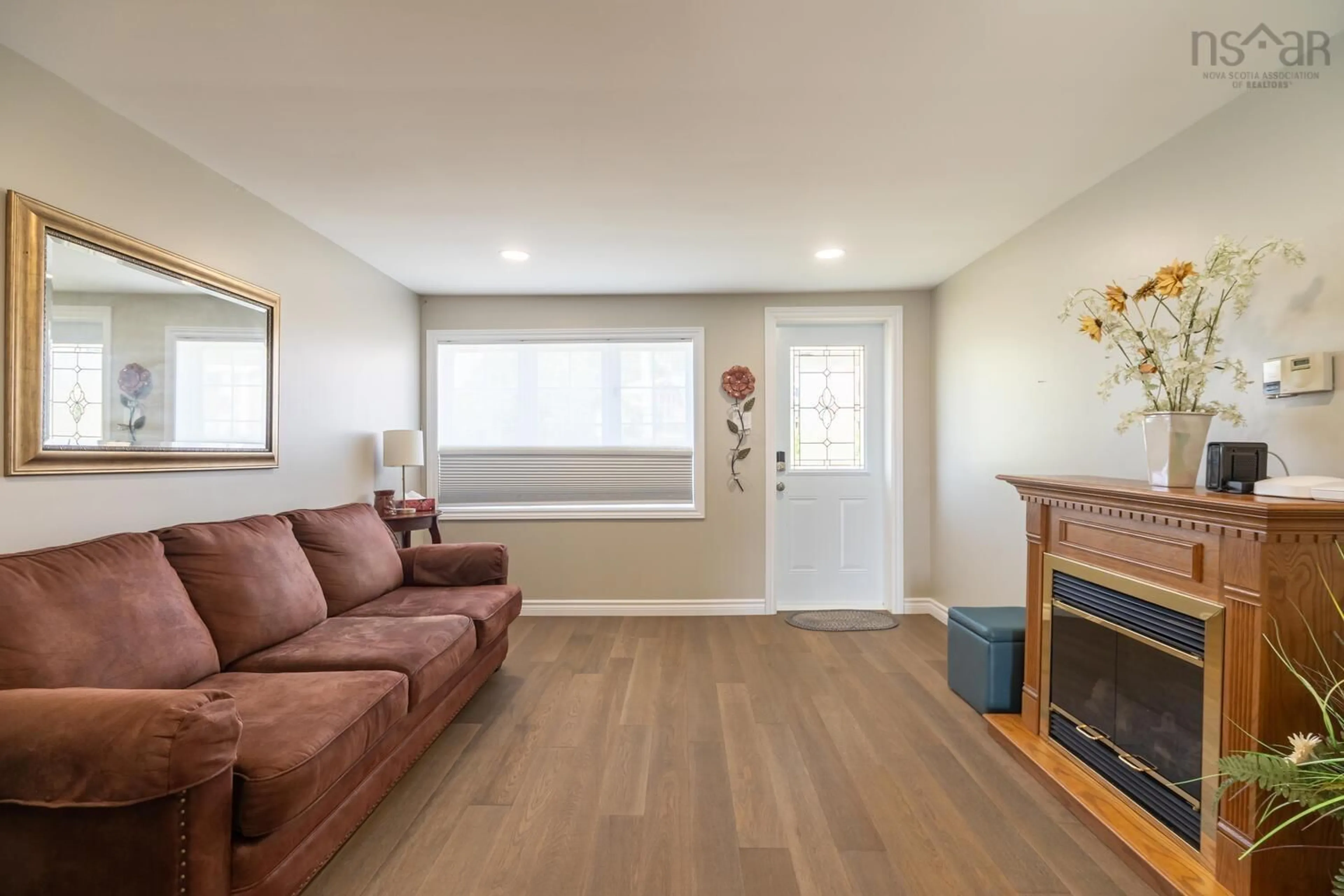 Living room with furniture, wood/laminate floor for 189 Boudreauville Rd, Petit-De-Grat Nova Scotia B0E 2L0