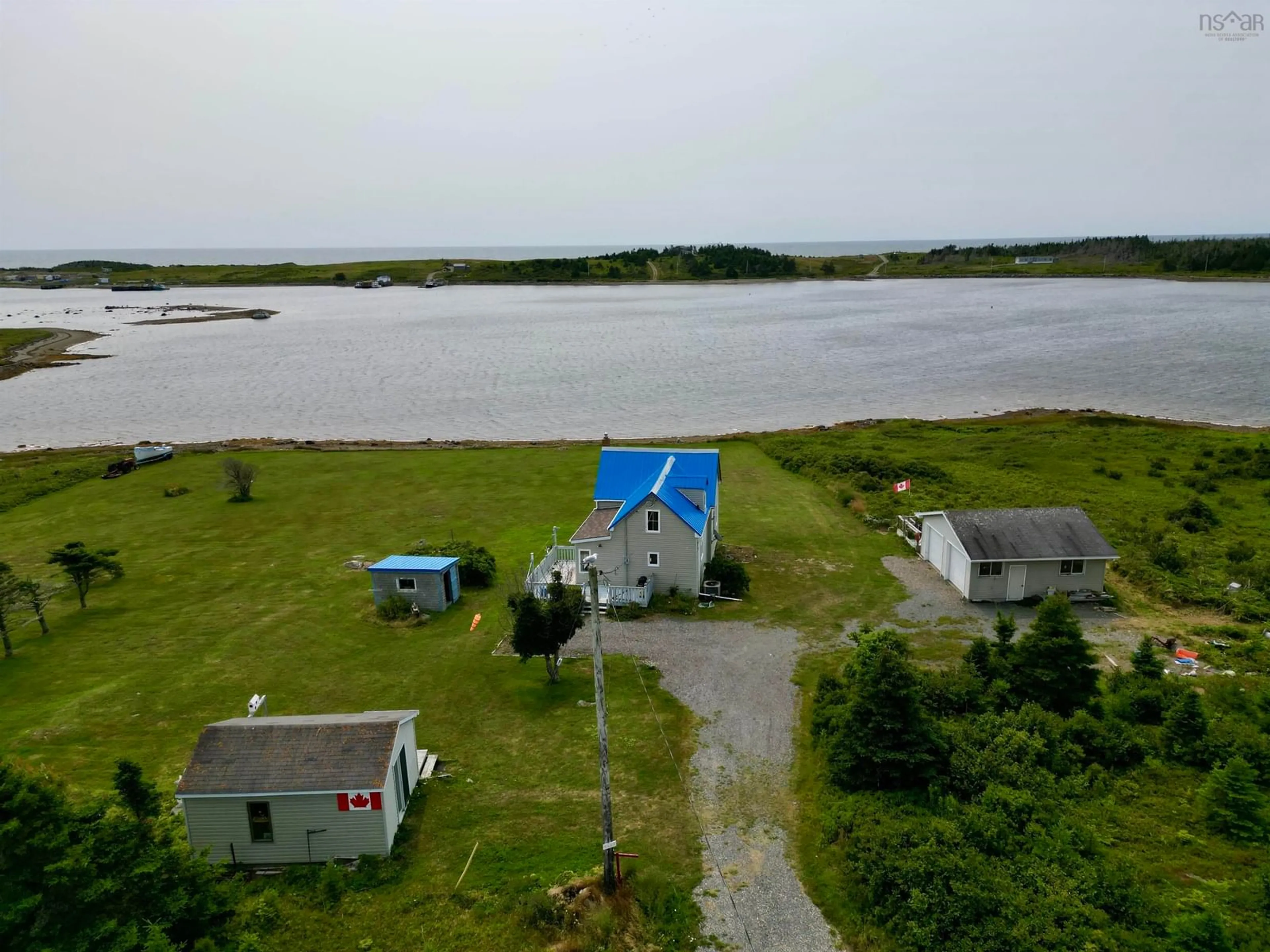 A pic from outside/outdoor area/front of a property/back of a property/a pic from drone, water/lake/river/ocean view for 9684 St. Peter's Fourchu Rd., Fourchu Nova Scotia B2J 1A5