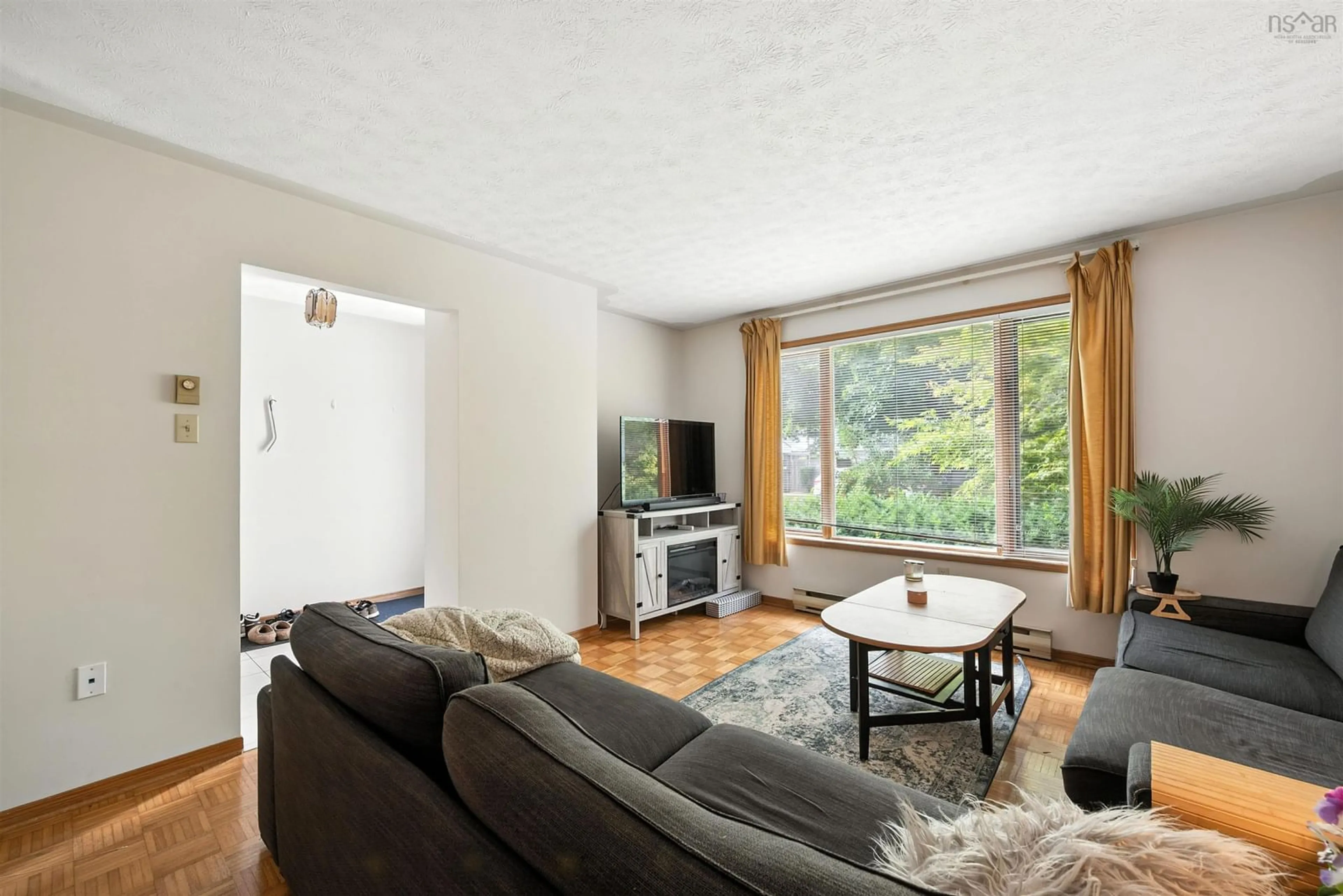 Living room with furniture, wood/laminate floor for 6614 First St, Halifax Nova Scotia B3L 1E2