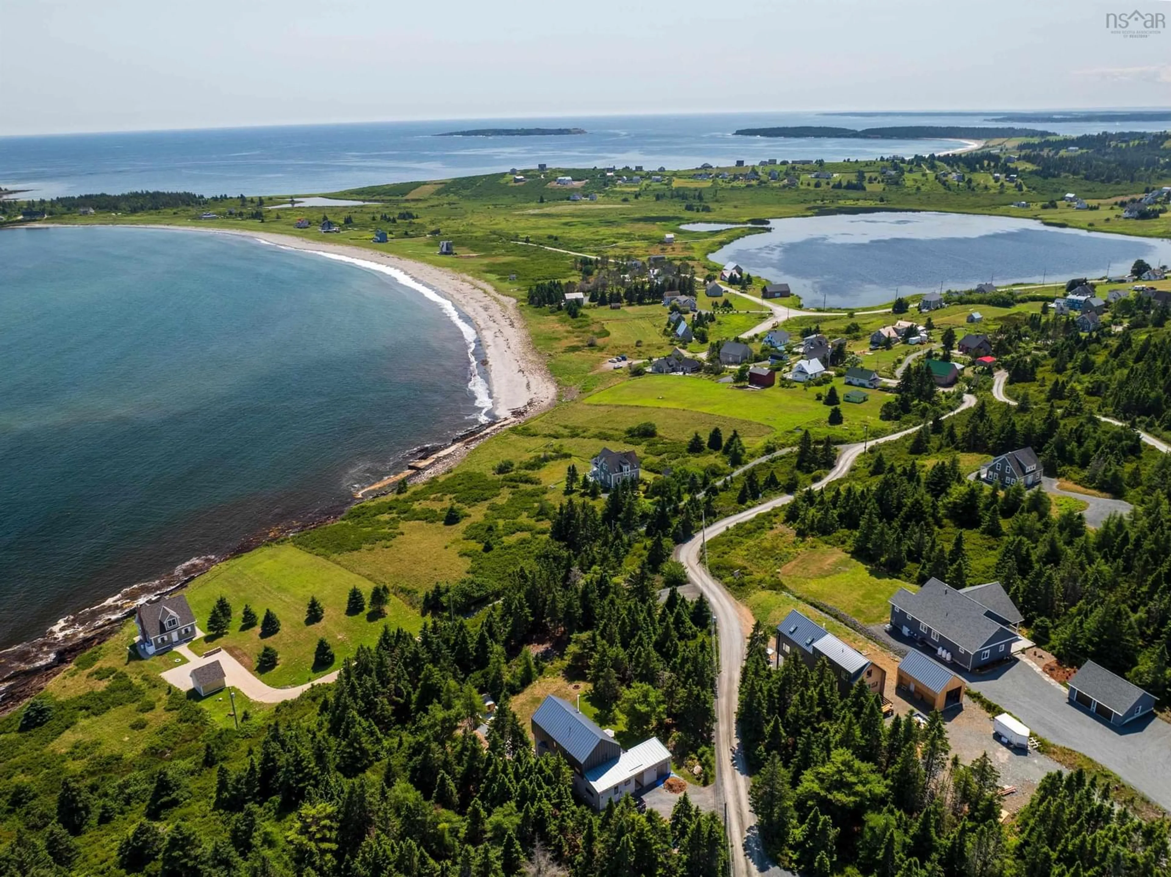 A pic from outside/outdoor area/front of a property/back of a property/a pic from drone, water/lake/river/ocean view for 18 Woodlot Lane, Kingsburg Nova Scotia B0J 2X0