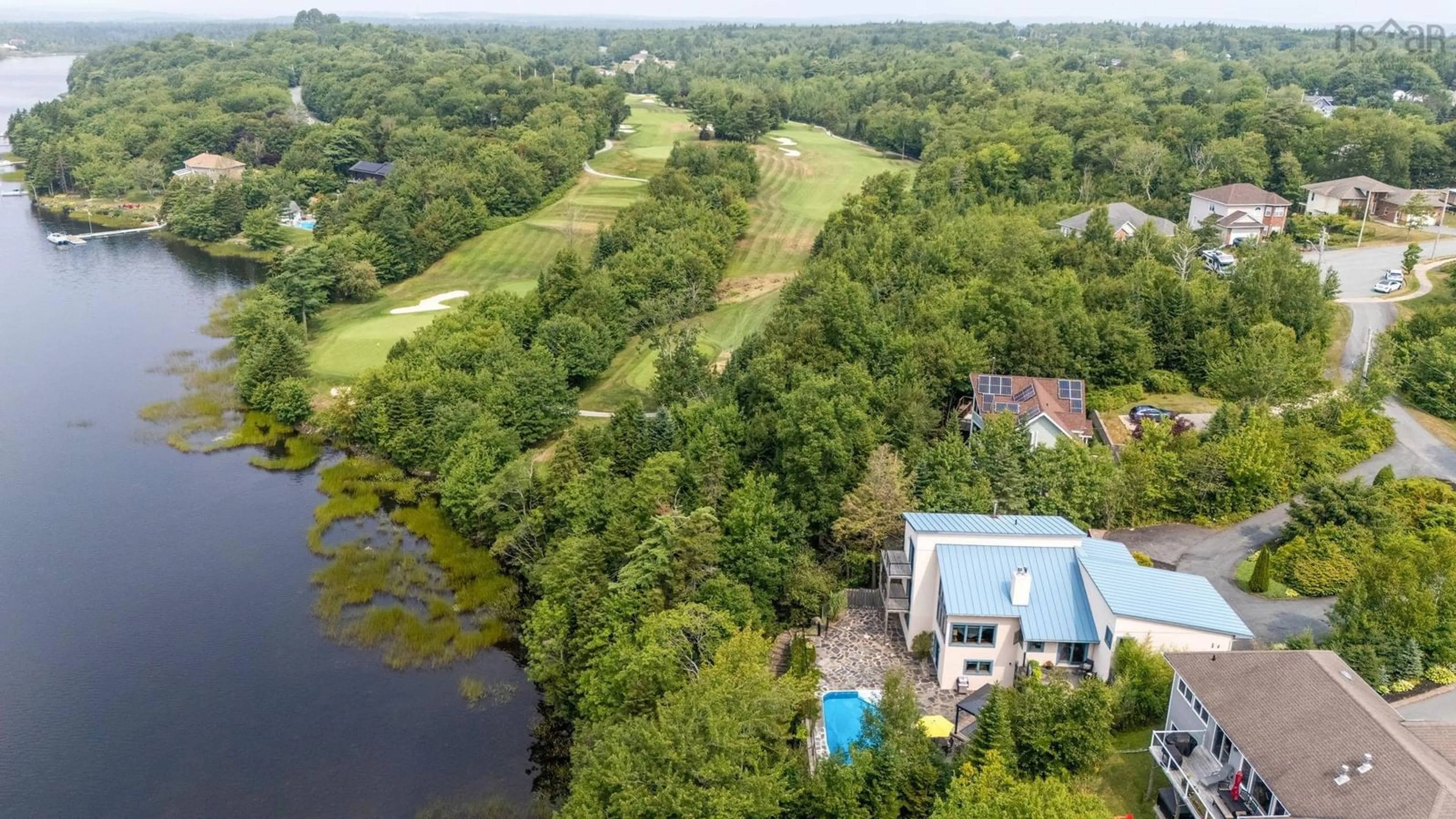 A pic from outside/outdoor area/front of a property/back of a property/a pic from drone, water/lake/river/ocean view for 49 Fairway Grove, Lake Loon Nova Scotia B2W 6M5