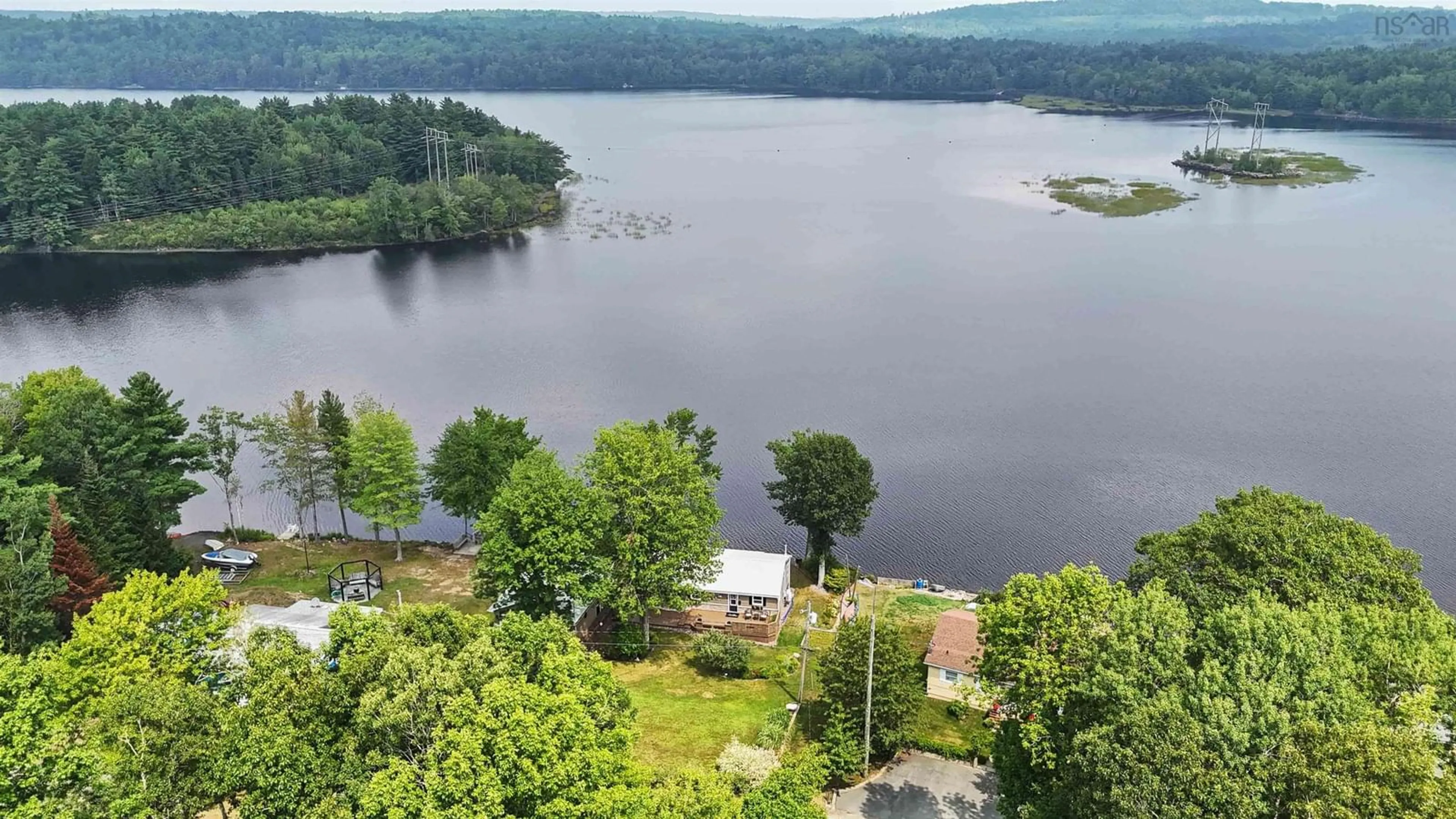 A pic from outside/outdoor area/front of a property/back of a property/a pic from drone, water/lake/river/ocean view for 87 Lake Road Number 5, Pine Grove Nova Scotia B0J 1E0