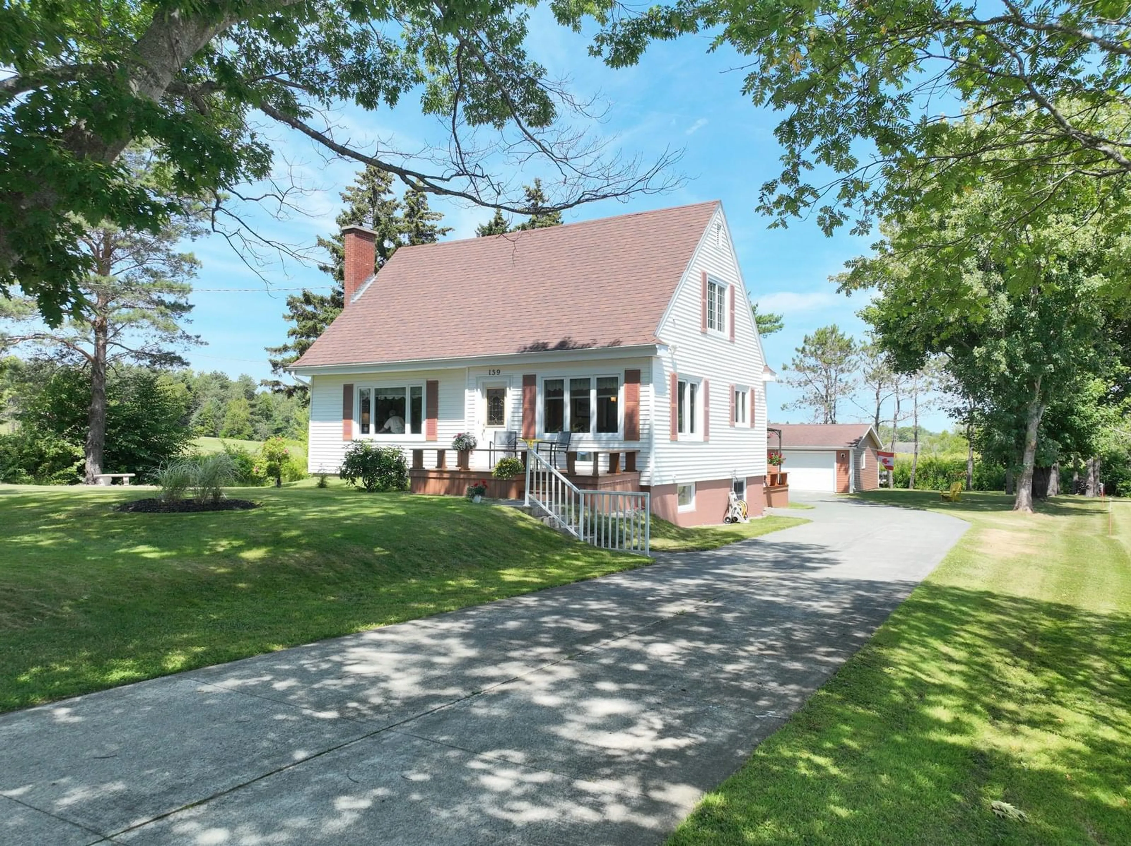 A pic from outside/outdoor area/front of a property/back of a property/a pic from drone, street for 159 Riverside Dr, Sydney River Nova Scotia B1S 1G6