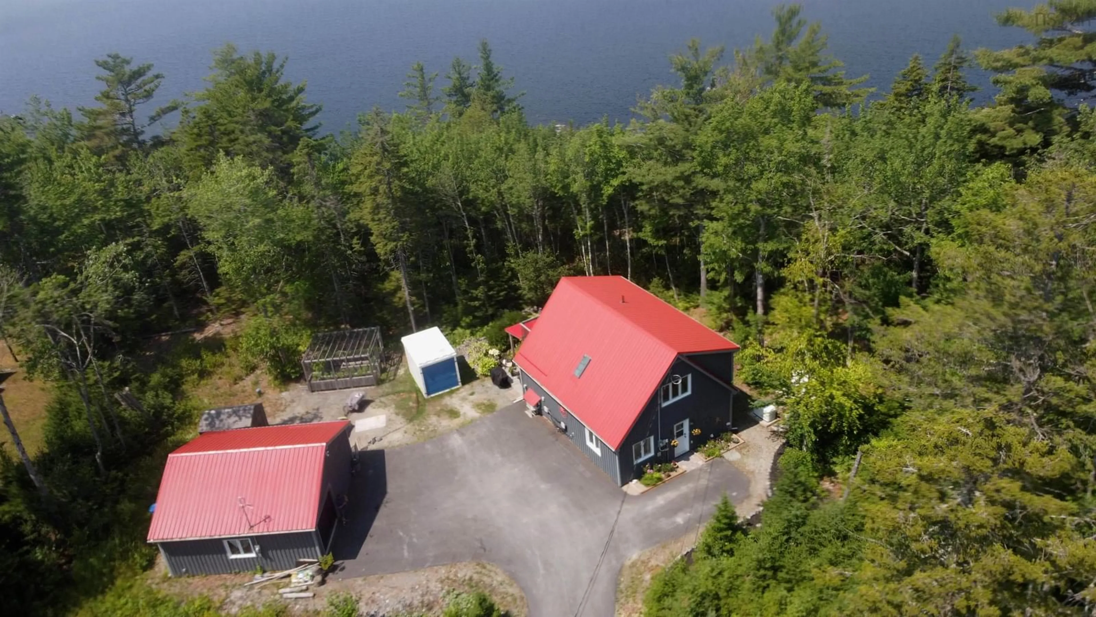 A pic from outside/outdoor area/front of a property/back of a property/a pic from drone, water/lake/river/ocean view for 62 Western Point Lane #4, East Uniacke Nova Scotia B0N 1Z0