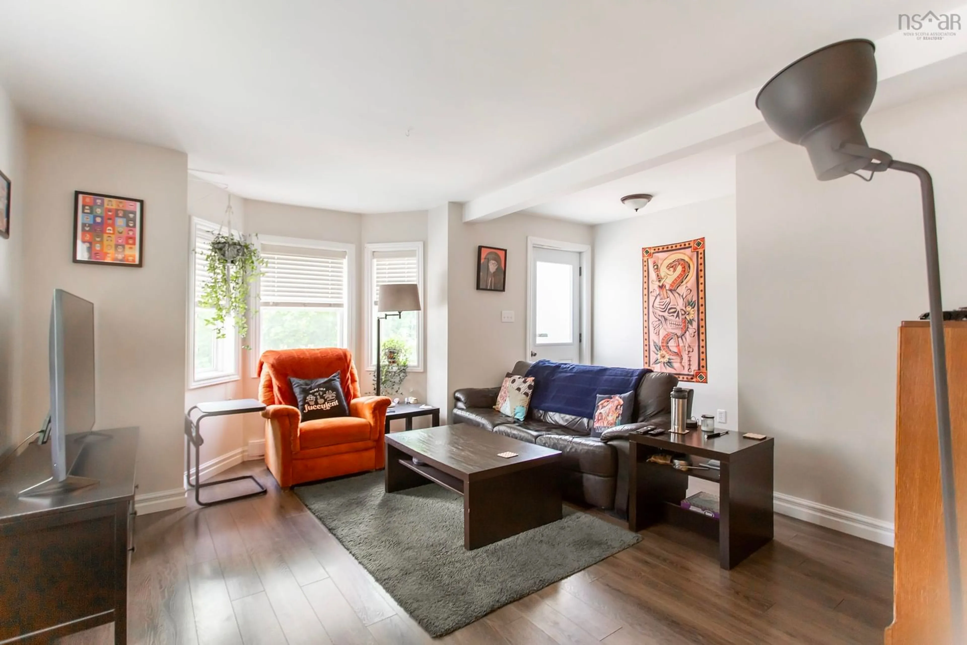 Living room with furniture, wood/laminate floor for 27 Canaan Ave, Kentville Nova Scotia B4N 1B8